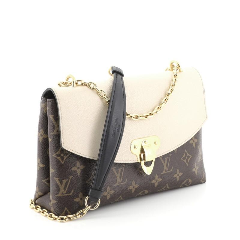This Louis Vuitton Saint Placide Handbag Monogram Canvas and Leather, crafted in brown monogram coated canvas and leather, features sliding chain link shoulder strap with leather pad and gold-tone hardware. Its flip-lock closure opens to a black