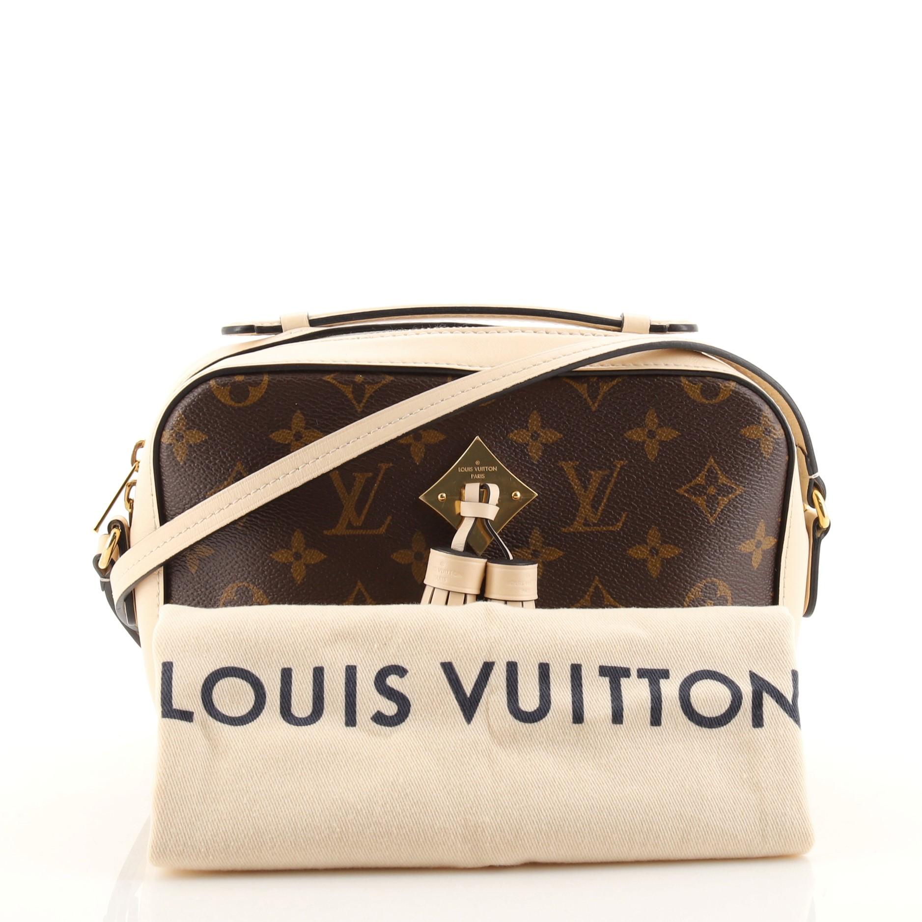 Condition: Good. Minor odor in interior. Creasing on exterior and strap, wear, darkening and marks on leather trims and strap. Moderate darkening and stains on zipper tape. Wear and stains in interior, scratches and tarnish on hardware.
Accessories: