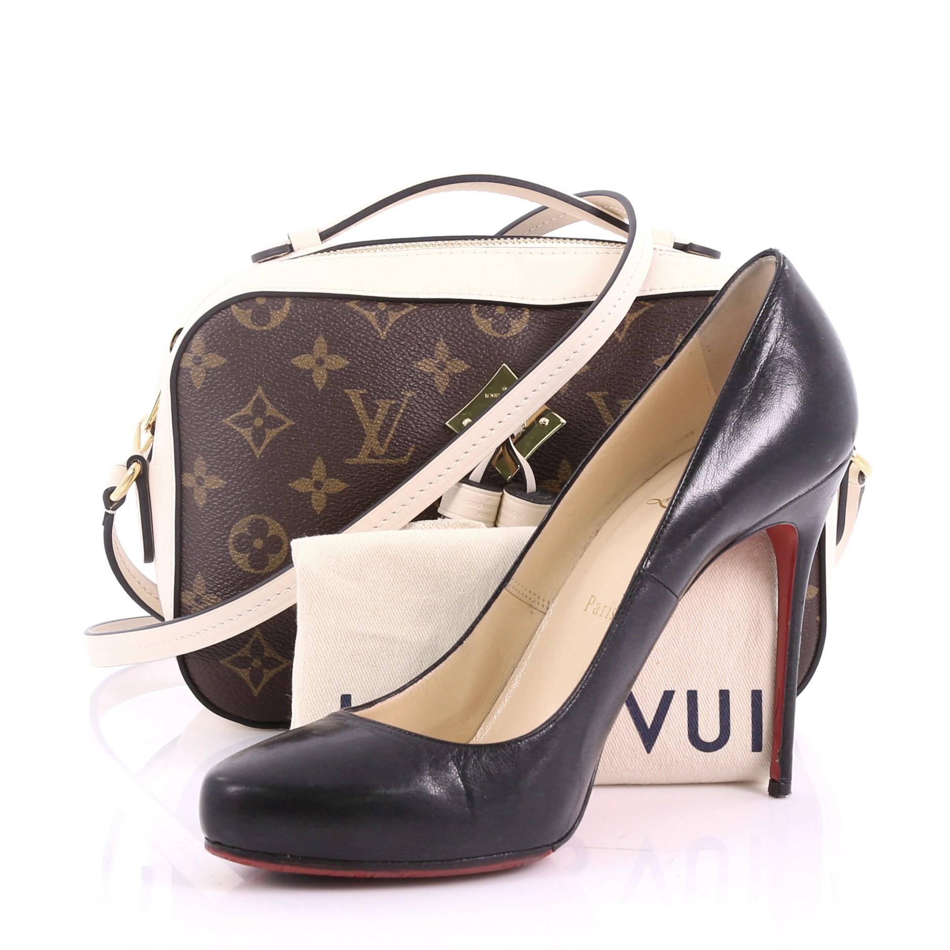 This Louis Vuitton Saintonge Handbag Monogram Canvas with Leather, crafted from brown monogram coated canvas, features top handle and long strap, leather tassels and gold-tone hardware. Its zip closure opens to a white leather interior with slip
