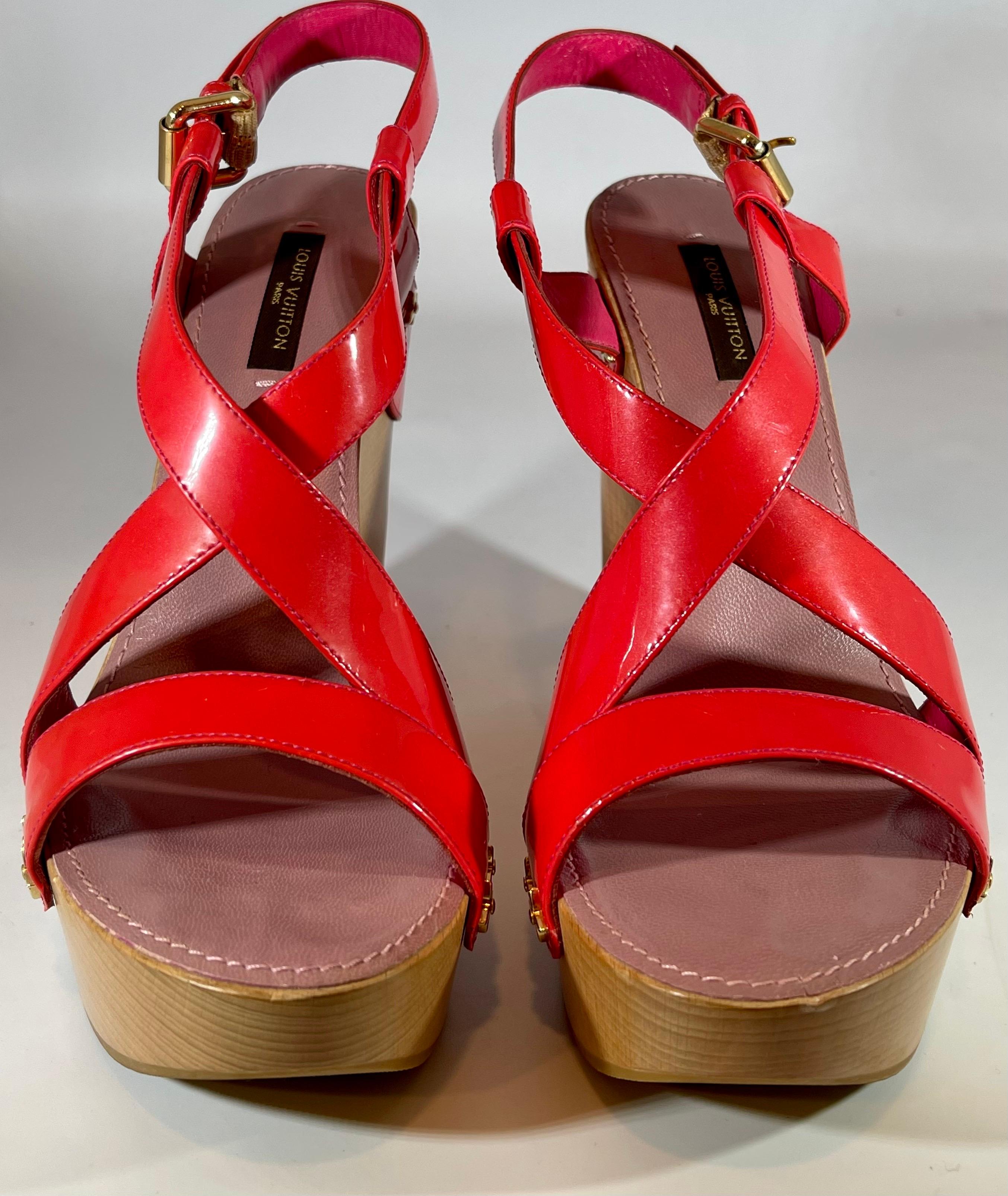 Louis Vuitton Sandals Reds Calf Leather 5 Inch Wood Heels Size Euro 38, Like New
Main color Red
Material Calf Leather
Serial # CL 0098
Maximum Width 7 cm /2.75 Inches
Heel Hight 12.5 cm / 4.92 inch
Made in Italy 
Women/Ladies
Black and white hi-top