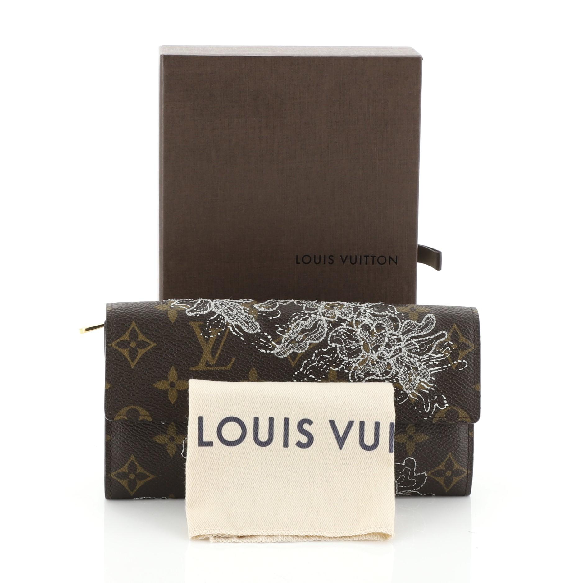 This Louis Vuitton Sarah Wallet Limited Edition Monogram Dentelle, crafted in brown monogram coated canvas, features delicate lurex lace embroidery and gold-tone hardware. Its snap button closure opens to a neutral leather interior with multiple