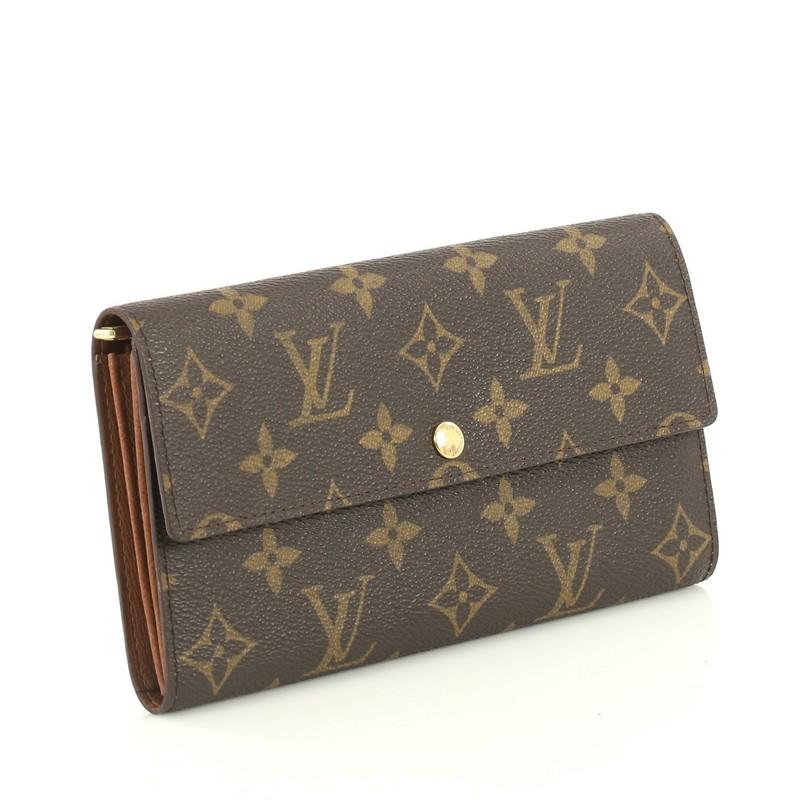 This Louis Vuitton Sarah Wallet Monogram Canvas, crafted from brown monogram coated canvas, features frontal flap and gold-tone hardware. Its snap closure opens to a brown leather interior with middle zip compartment. Authenticity code reads: