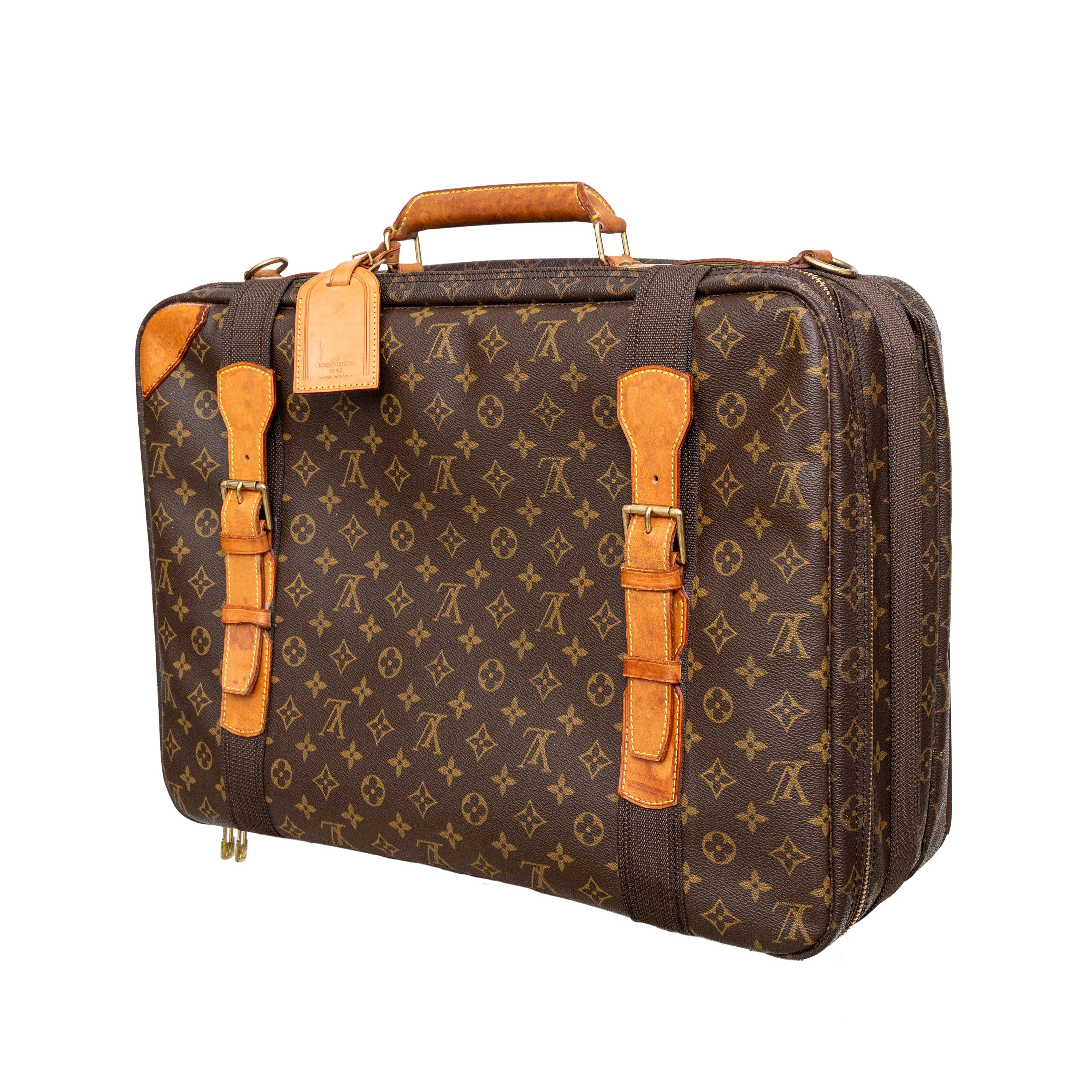 Travel in style with the vintage Louis Vuitton Satellite Monogram Travel Bag. Crafted with elegant monogram canvas and natural leather, this bag features a zip closure and double buckle fastener for added security. The beige canvas lining and