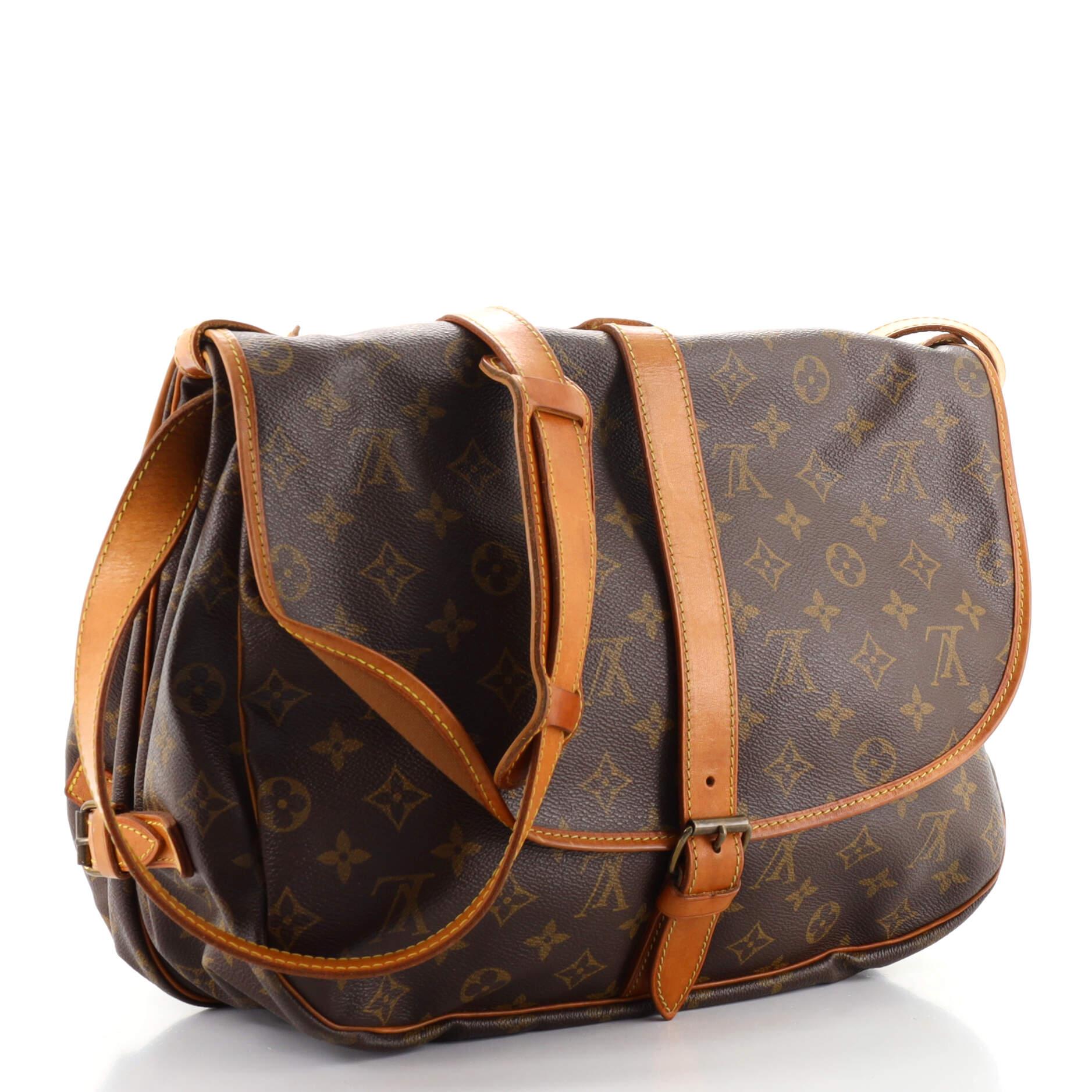 Condition: Fair. Odor in interior. Creasing on exterior, heavy darkening, wear, scuffs and watermarks on leather trims and strap, cracking on front closure belt. Moderate wear in interior, scratches and tarnish on hardware.
Accessories: No