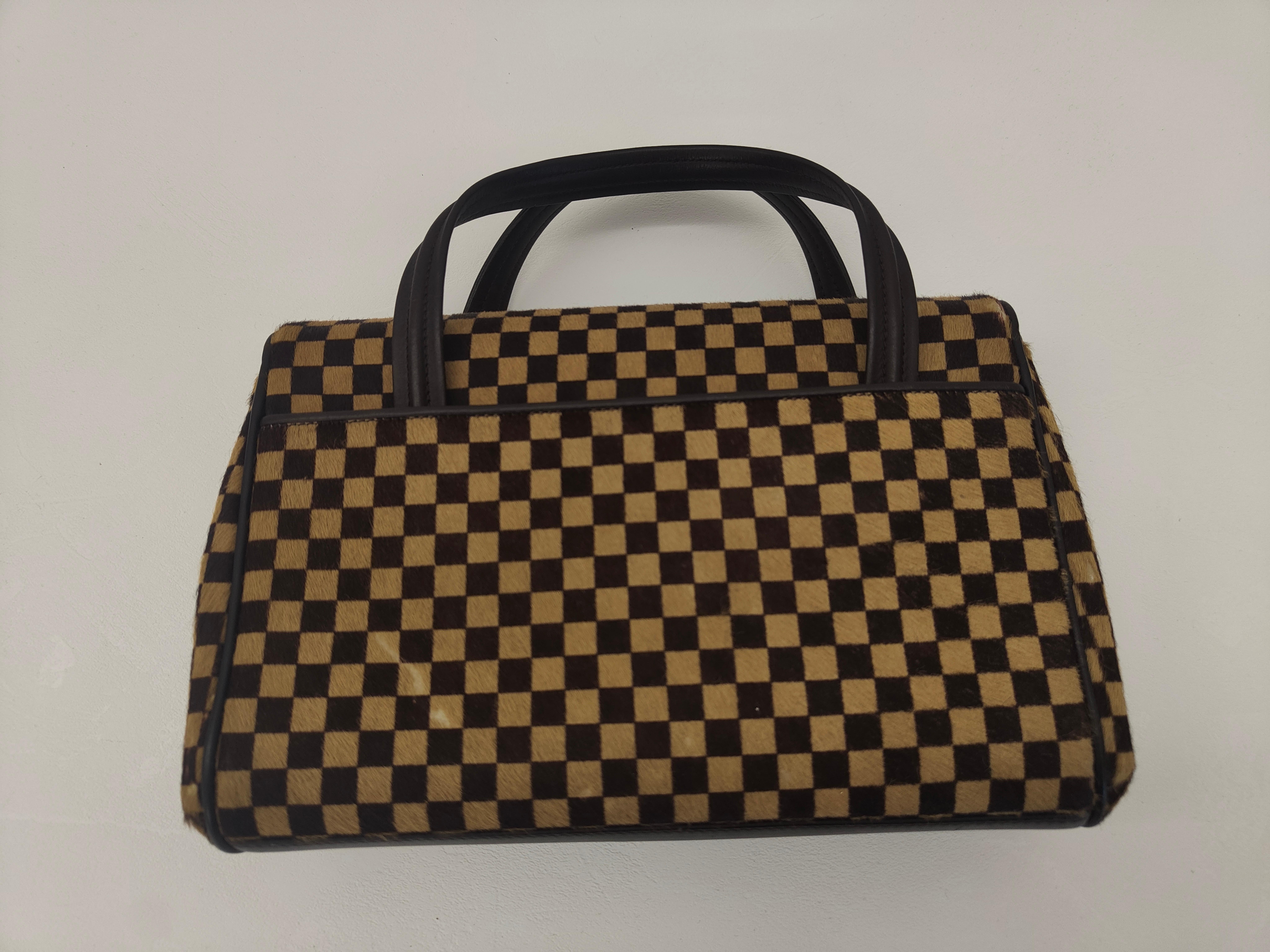 Louis Vuitton Sauvage denim handbag
Louis Vuitton by Marc Jacobs damier ponyhair hand bag
