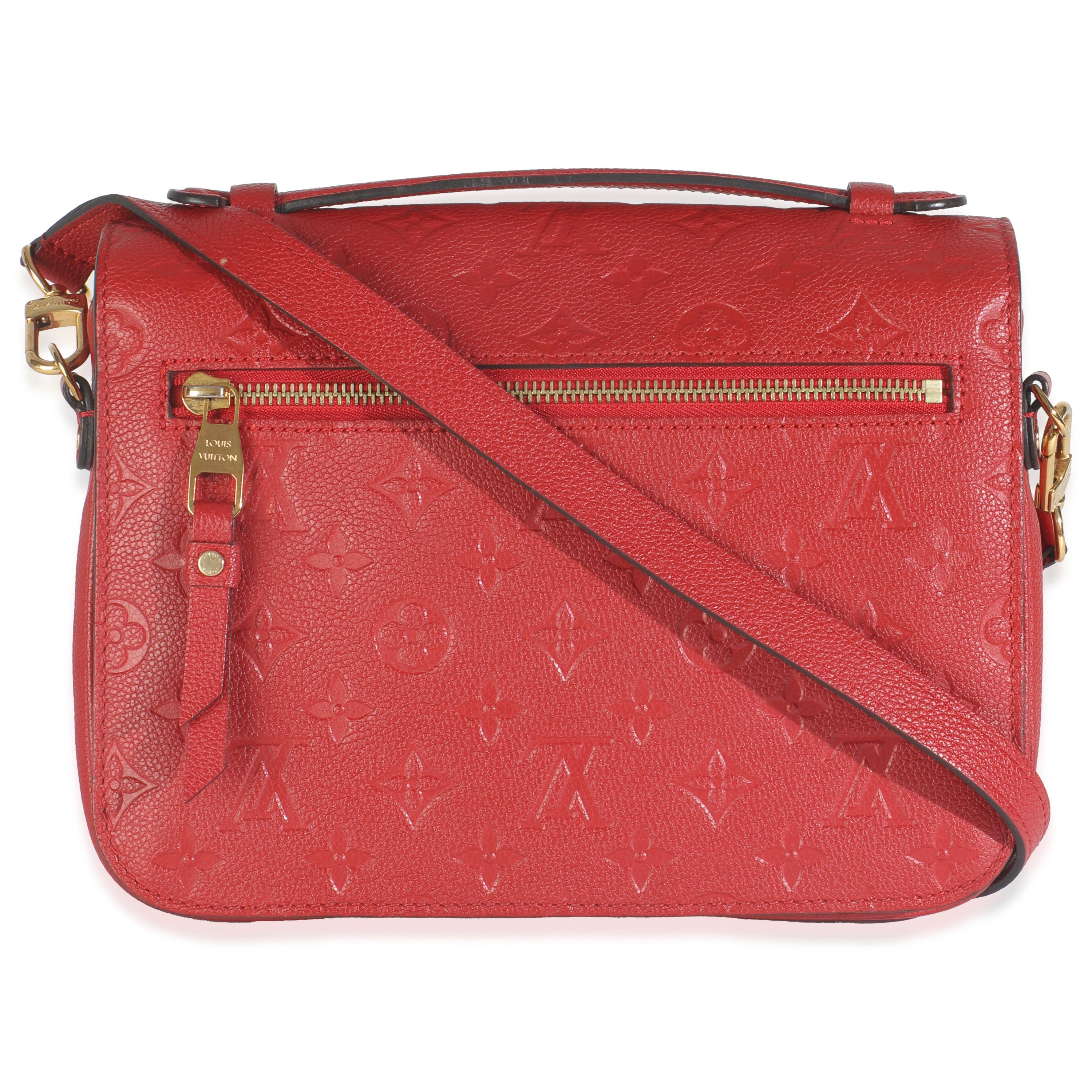 Listing Title: Louis Vuitton Scarlet Monogram Empreinte Pochette Metis
SKU: 149048
MSRP: 3000.00 USD
Condition: Pre-owned 
Handbag Condition: Very Good
Condition Comments: Item is in very good condition with minor signs of wear. Faint scratching on
