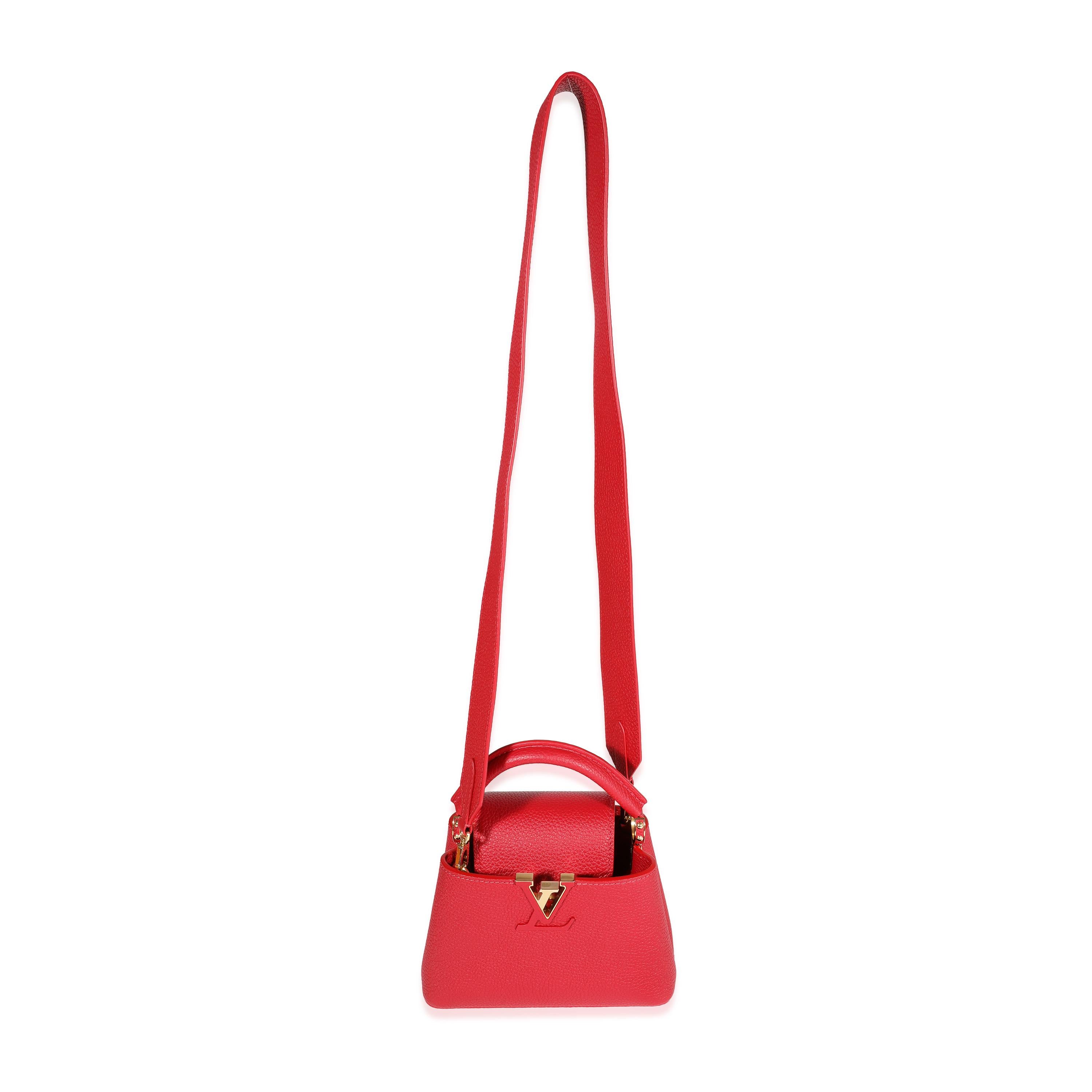 Listing Title: Louis Vuitton Scarlet Taurillon Capucines Mini
SKU: 122851
MSRP: 6100.00
Condition: Pre-owned 
Handbag Condition: Excellent
Condition Comments: Excellent Condition. Faint scuff at exterior. Light scratching at hardware. Plastic at