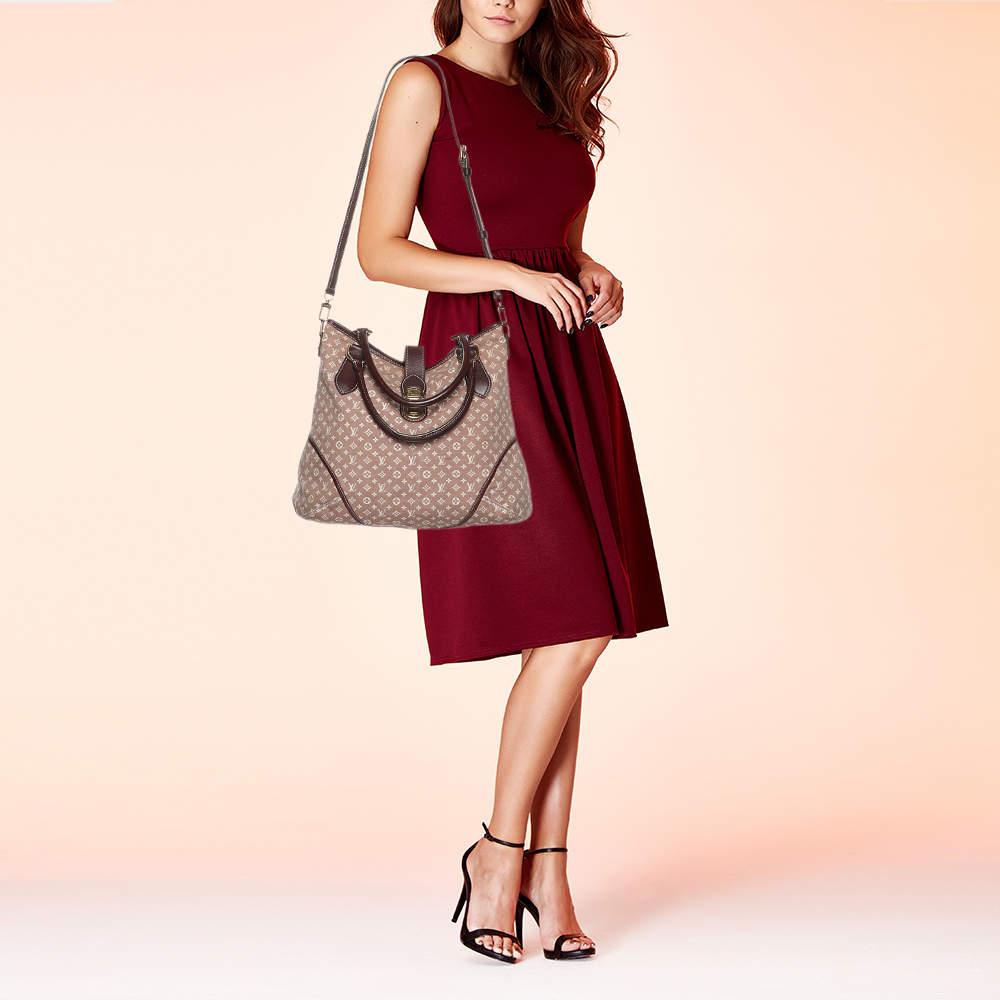 Famous for their luxury bags and leather goods Louis Vuitton is sure to win you with this Elegie bag. The lovely bag is crafted from monogram Idylle canvas and leather. It flaunts two handles gold tone hardware and the top opens to a spacious fabric