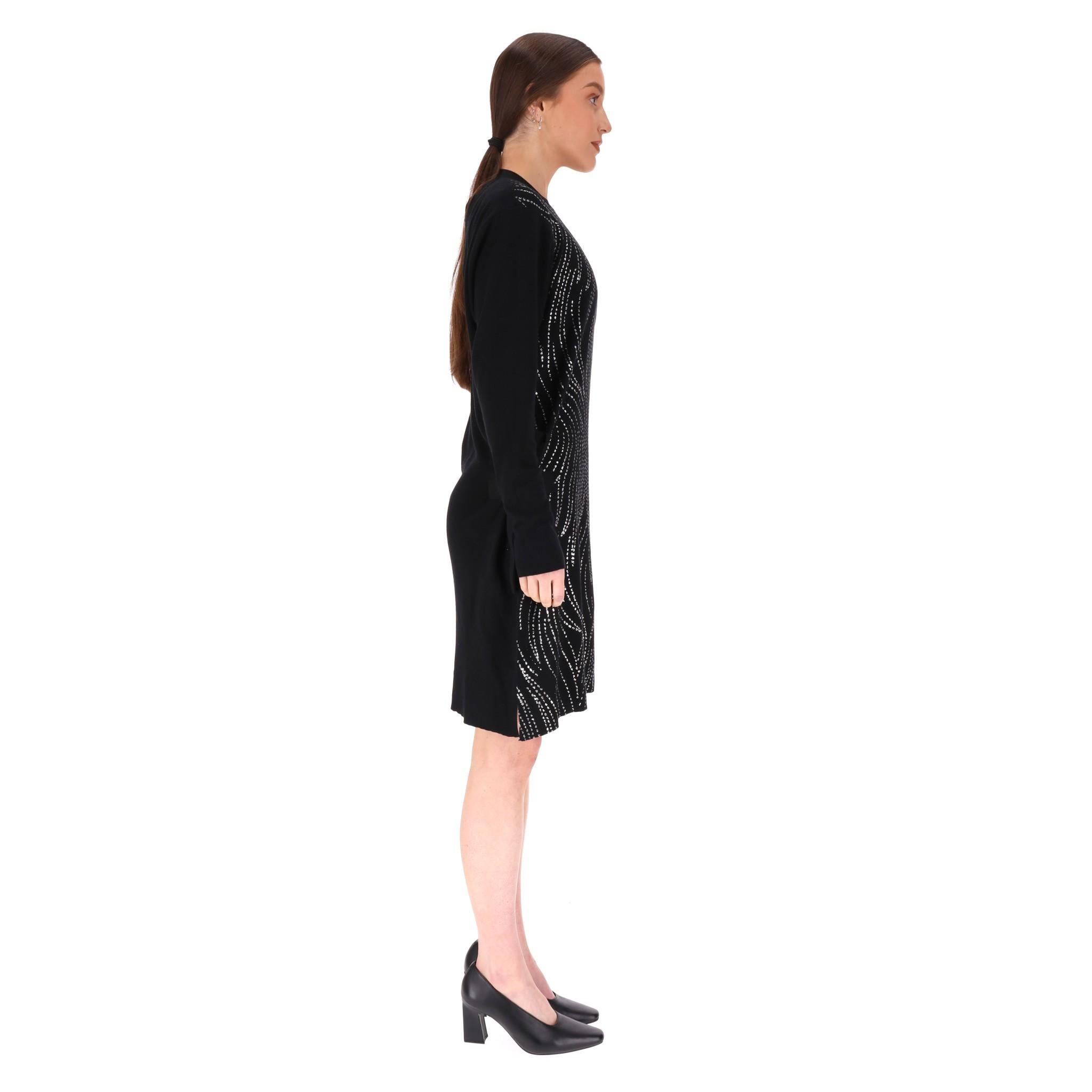 Louis Vuitton Sequin Embellished Silk, Cashmere & Wool Blend Dress

Black, mini dress embellished with sparkling, silver mini sequined design to the front.

Fitted silhouette, long sleeves and zipped crew neckline with deep-neck to rear.

Rrp
