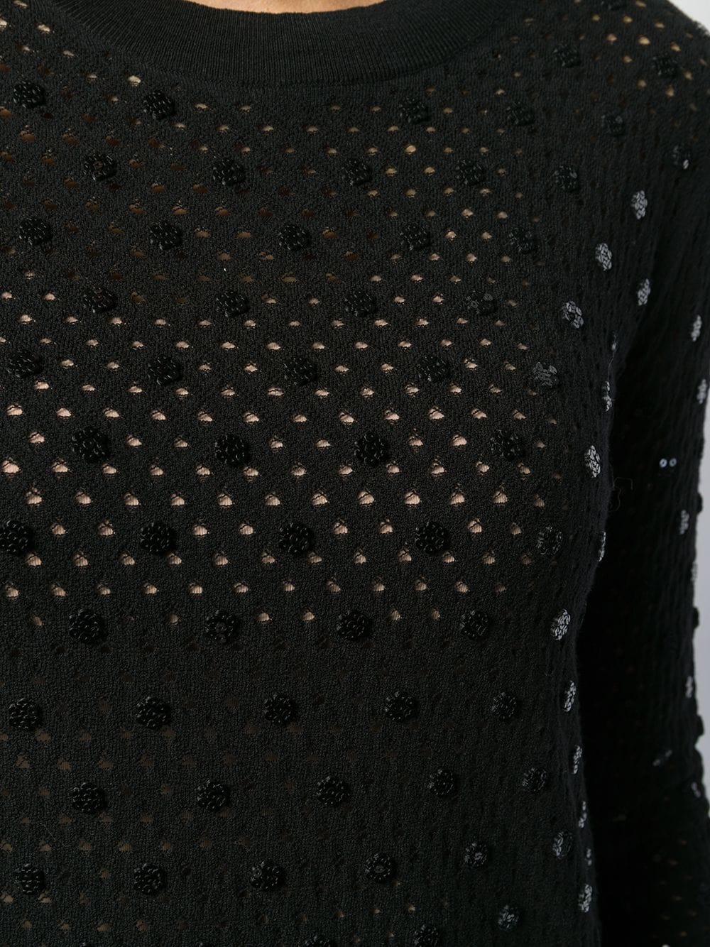 Dieser stilvolle, gebrauchte Pullover von Louis Vuitton wurde in Italien fachmännisch aus einer komplizierten Mischung aus schwarzer Wolle und Polyester gefertigt und verfügt über lange Ärmel, einen Rundhalskragen und gerippte Details. Das