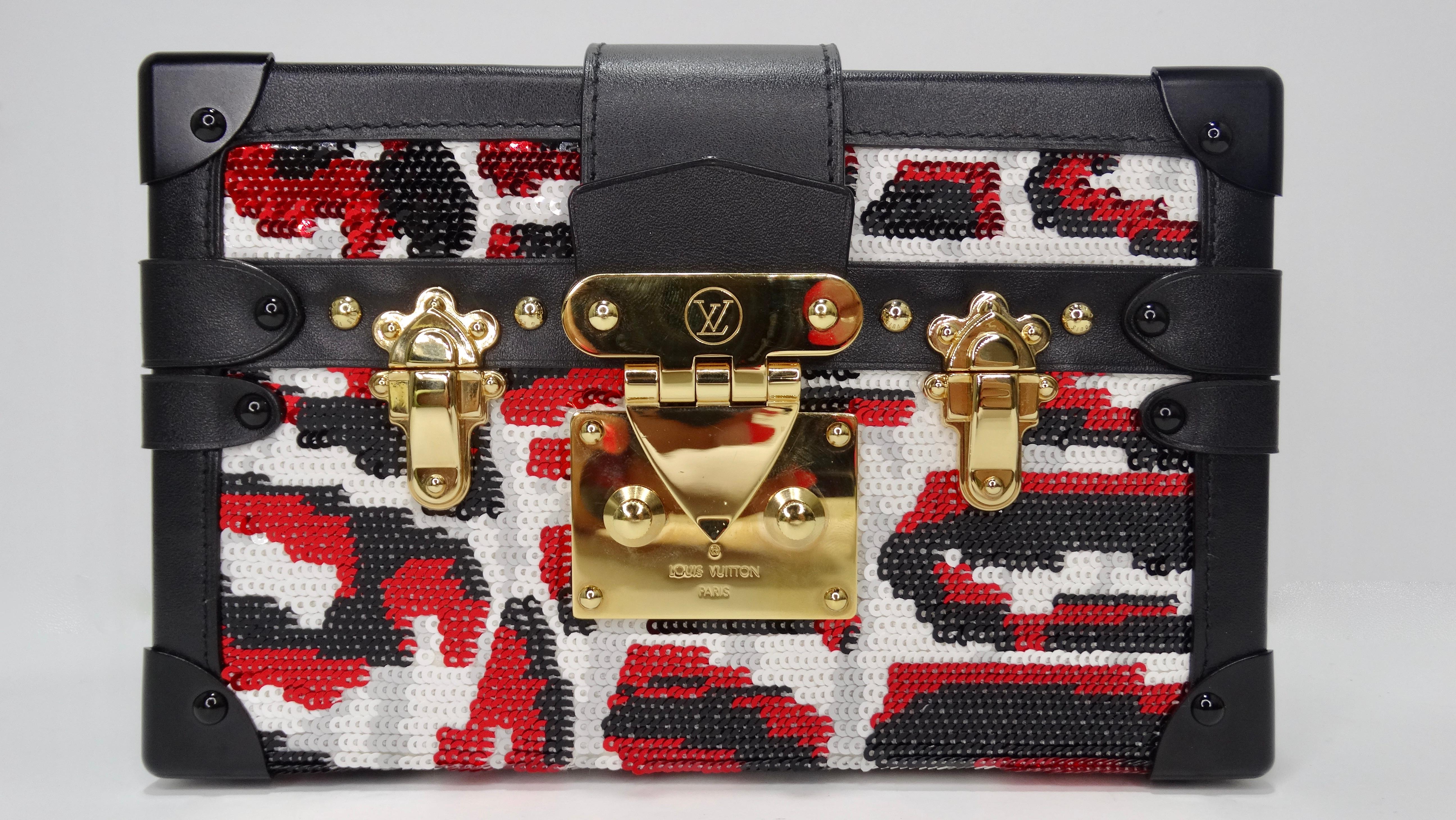 The sequin clutch you never knew you needed-- until NOW! This stunning sequin clutch by Louis Vuitton is a limited edition piece featuring red, black, and white sequins with lambskin leather trim. The inside of the clutch features a sheepskin lining