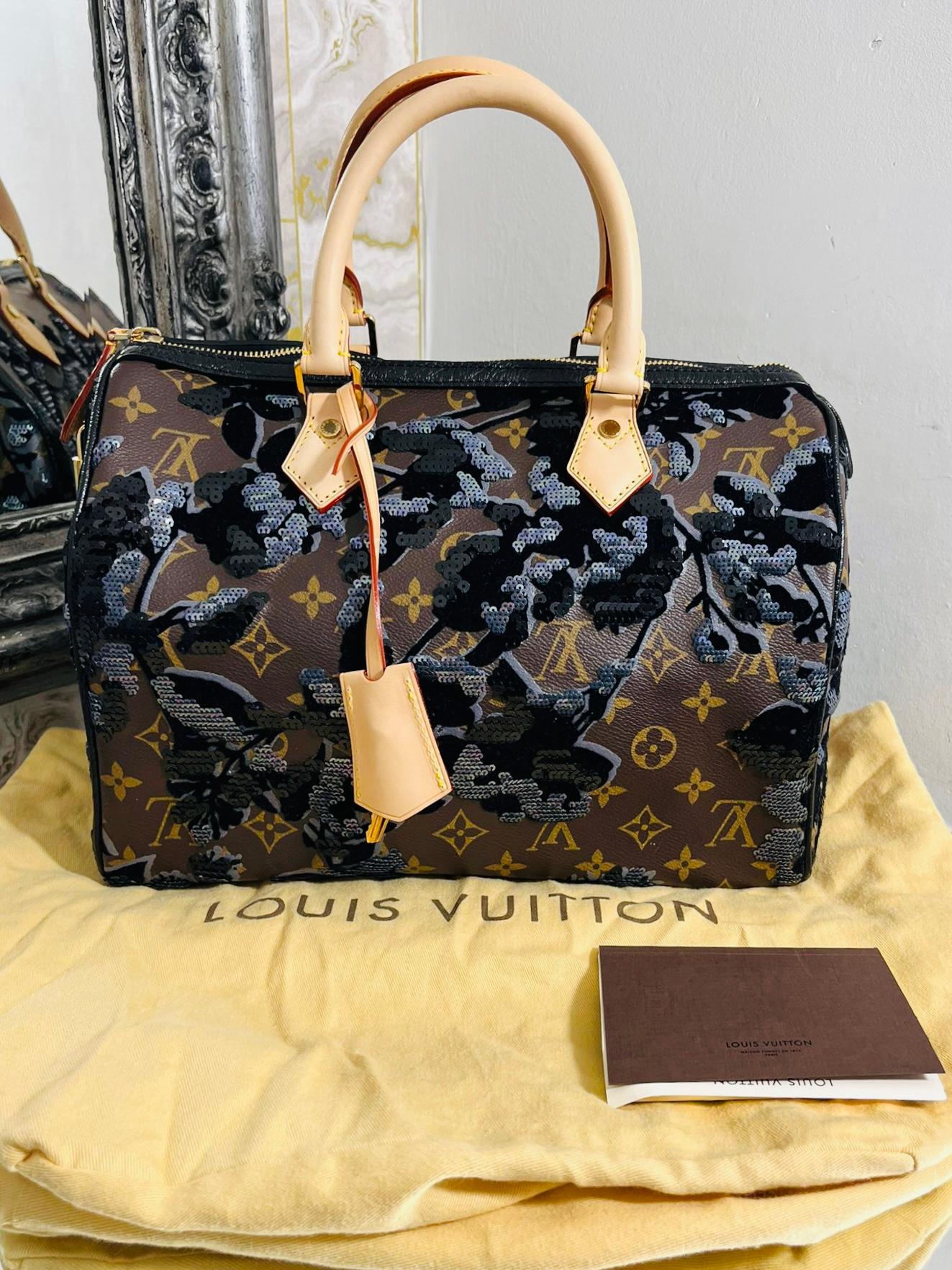 Louis Vuitton Sequin, Velvet & Coated Canvas Fleur De Jais Speedy 30 Bag

From fall 2010 is this Speedy ltd edition bag with gold zipper closure, leather 

roll top handles, key, lock and clochette.

'LV' logo though out with black sequin and velvet