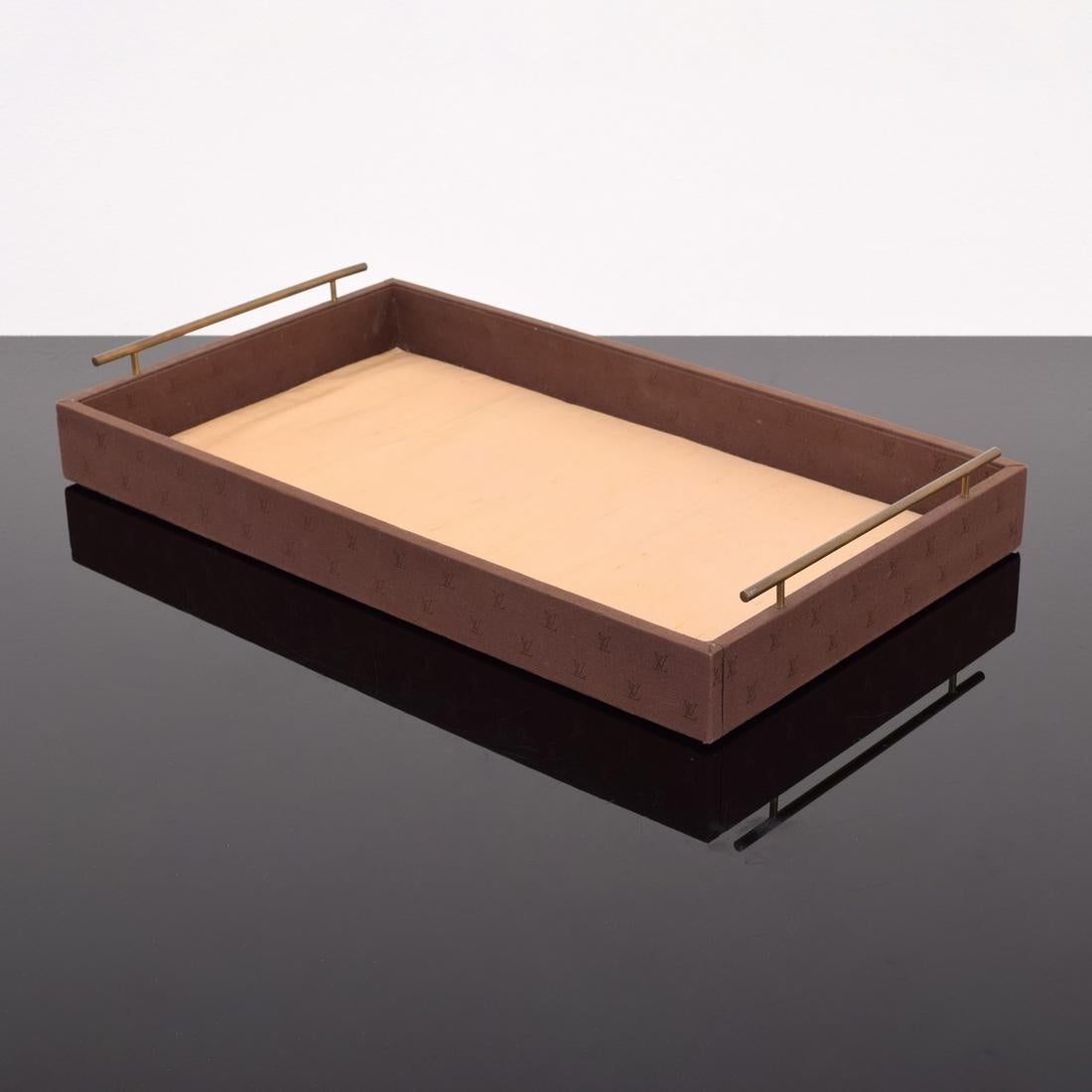 Artist/Designer: Louis Vuitton
Marking(s); notes: marking(s)
Materials: wood, metal, fabric
Additional Information: LV mongrammed fabric wrapped tray

