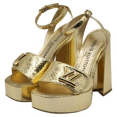 Louis Vuitton - Sandali con plateau in pitone in oro
