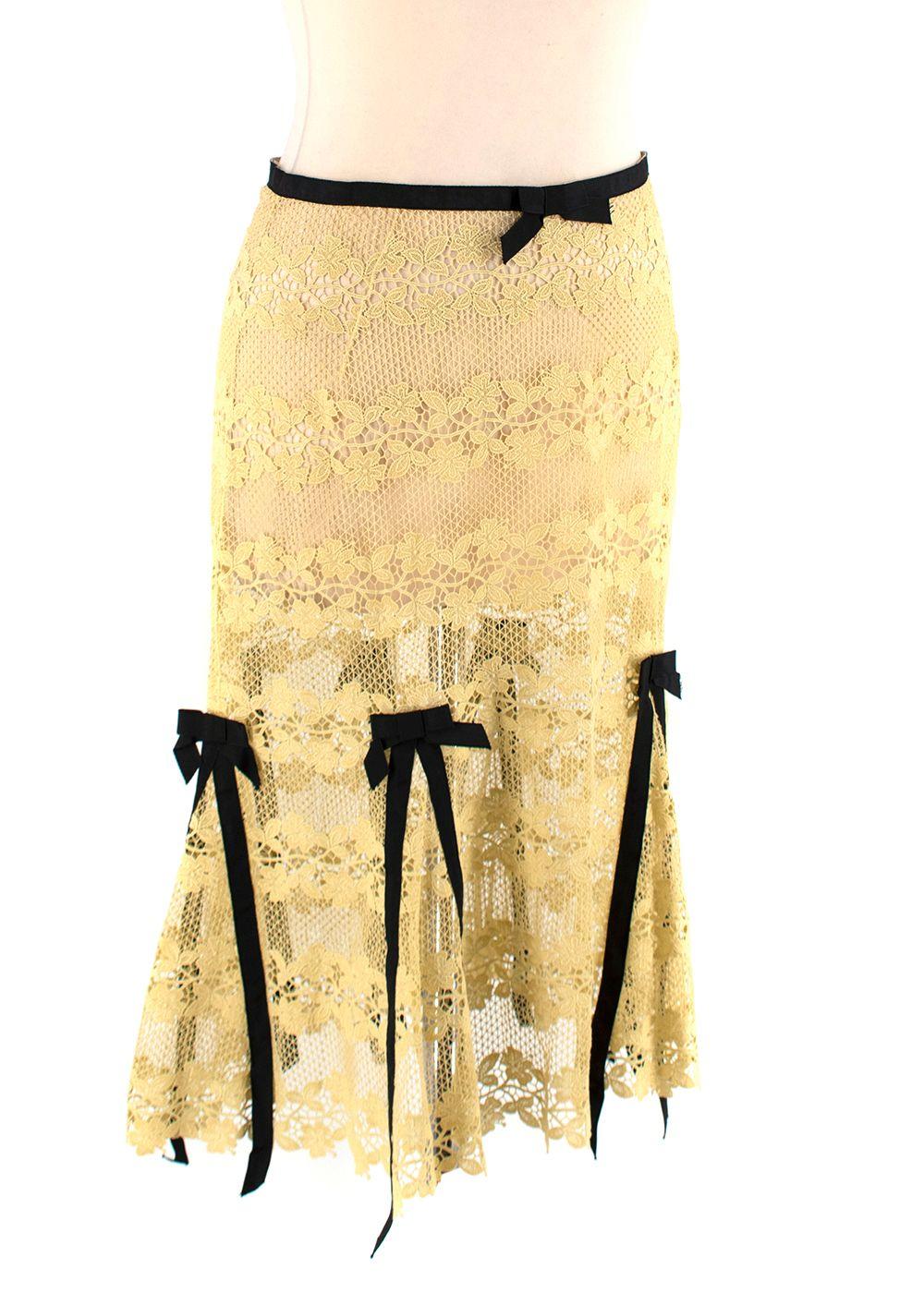 Louis Vuitton Sheer Yellow Lace Bow-Trimmed Skirt

- Sheer floral lace, mid-length skirt trimmed with black grosgrain bows, and tonal waistband
- Concealed back zip
- See-through, unlined 

Materials 
100% Cotton 

Made in France
Dry Clean Only