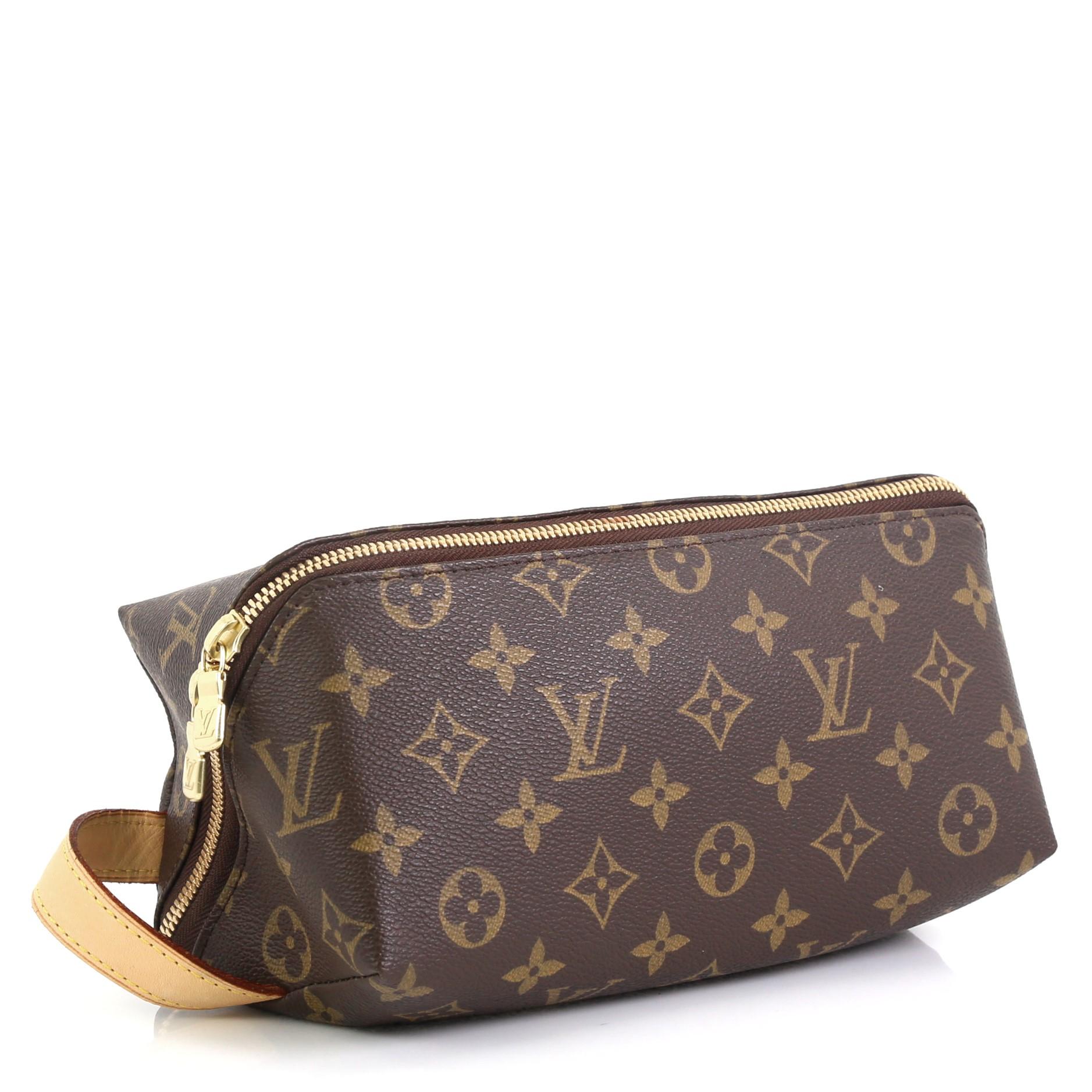 This Louis Vuitton Shoe Care Kit Monogram Canvas, crafted in brown monogram coated canvas, features a leather handle, and gold-tone hardware. Its zip closure opens to a brown leather interior. Authenticity code reads: CT1016 

Estimated Retail