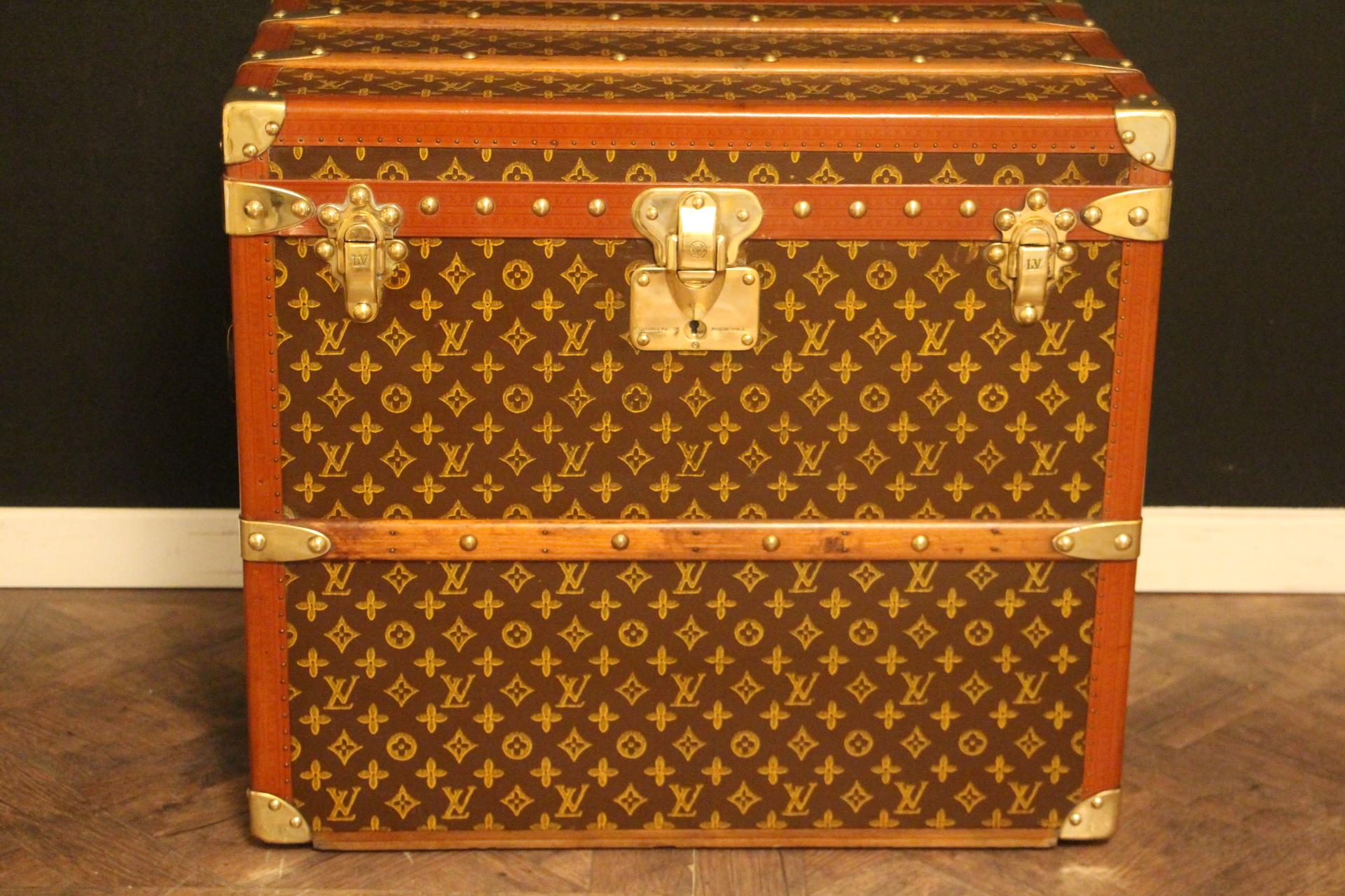 This magnificent Louis Vuitton shoe trunk features stenciled canvas monogram, Louis Vuitton stamped solid brass locks, studs and large leather side handles. It also has got honey color lozine trim.
It also has painted customized stripes on its
