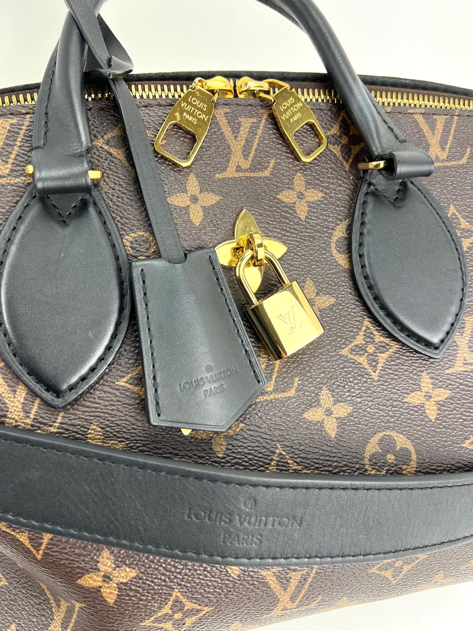 Pre-Owned  100% Authentic
LOUIS VUITTON Flower Zippered PM Monogram Tote
RATING: B...Very Good, well maintained,
shows minor signs of wear
MATERIAL: monogram canvas, leather trim
STRAP: LV removable leather strap
39'' long with 2 claw hooks on