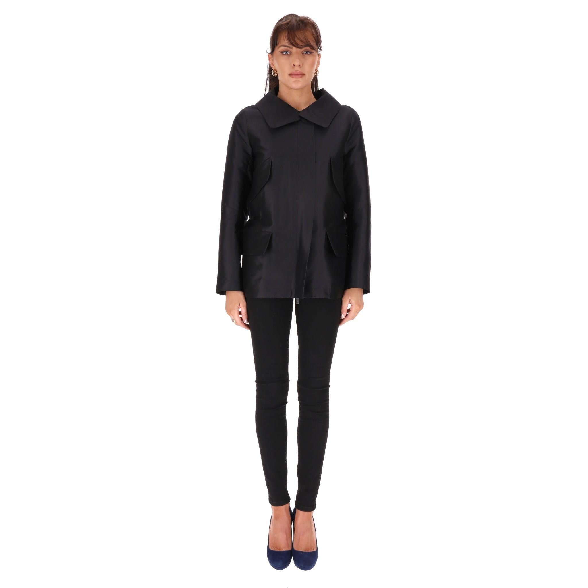 Louis Vuitton Silk Jacket/Coat

Black longline jacket designed with four flap pockets to the front.

Cut in a straight silhouette with elasticated detailing at rear.

Featuring open collar and black hardware with 'LV' logo engraved on the