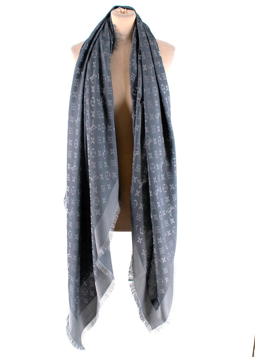 Louis Vuitton Charcoal Grey Silk & Wool Monogram Shine Shawl 

This sophisticated shawl, woven with a tone-on-tone Monogram pattern, is given a subtle shimmer by the use of a soft shine yarn.

- Luxurious soft silk and wool texture 
- Iconic LV