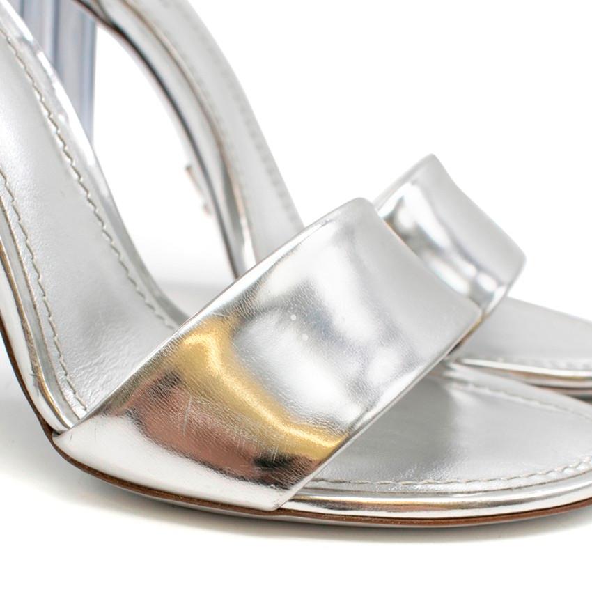 Louis Vuitton Silver Crystal Flower Sandals

- Silver leather toe and ankle strap
- Silver-tone buckle
- Fleur De Lis shaped transparent acrylic heel 
- LV Logo on the underside of the shoe 

Condition 9.5/10 - Tried on once, some very light scuffs