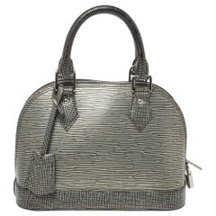 Louis Vuitton Alma BB Vernis Jungle Dots Handbag at 1stDibs