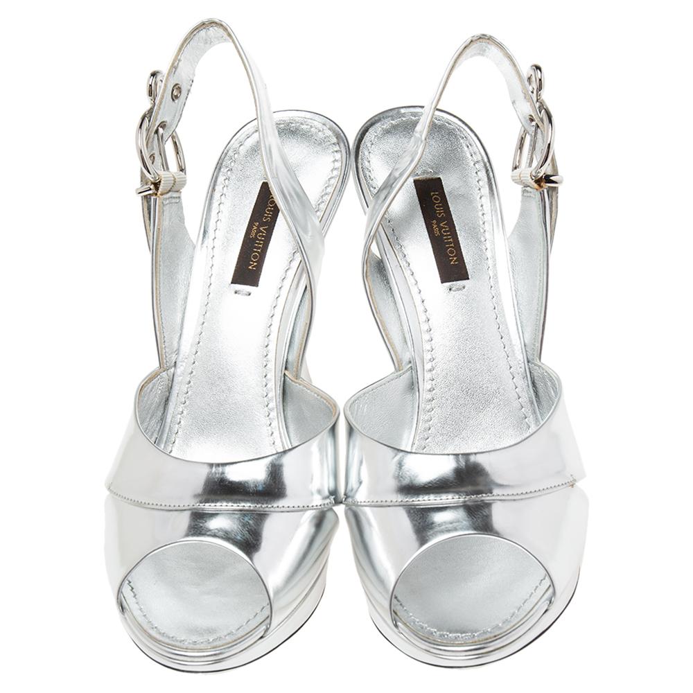 These stunning sandals by Louis Vuitton will perfectly complement your party dresses. They are crafted from silver leather with buckled slingbacks. They are completed with smooth insoles and 10 cm heels.

Includes: Original Dustbag, Original Box,