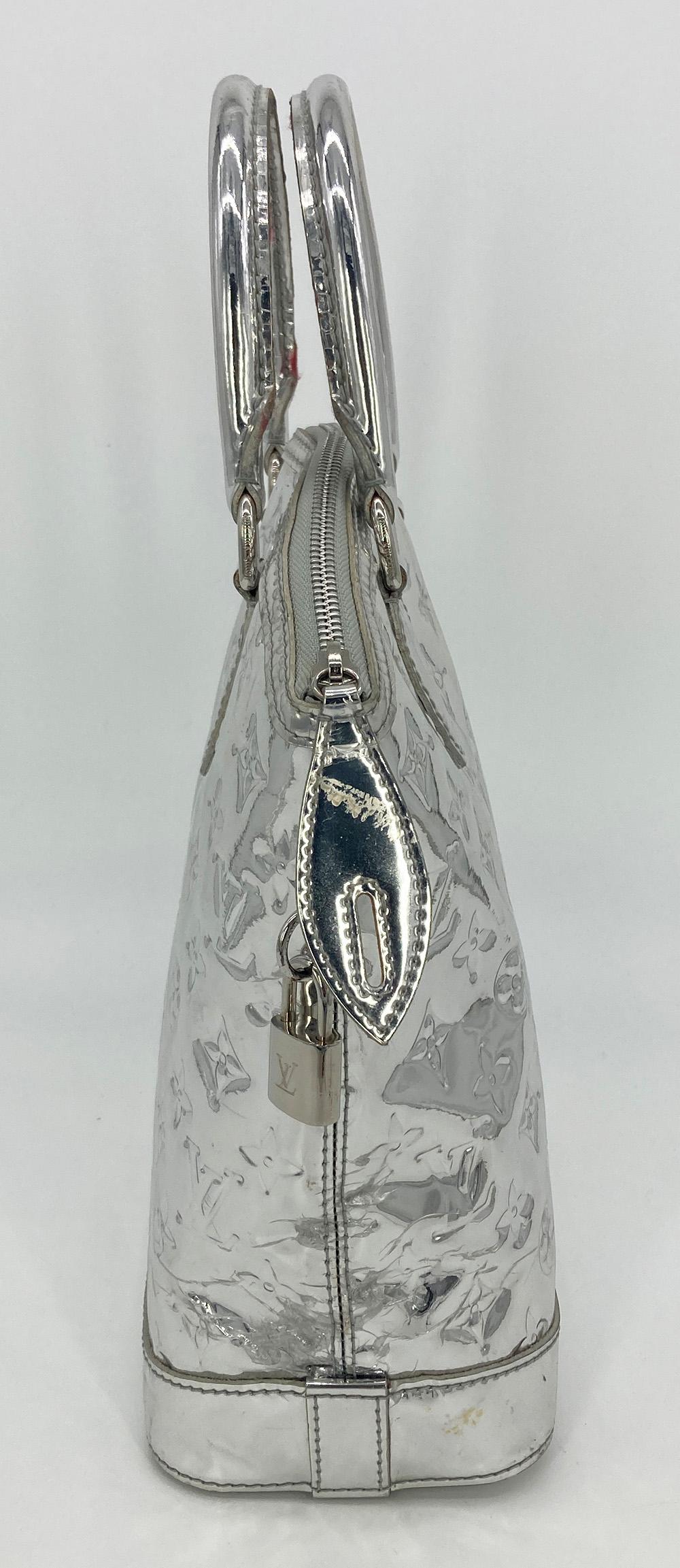 Louis Vuitton Silver Mirror Lockit Bag in good condition. Silver patent leather with monogram embossed pattern throughout and silver hardware. Double top handles and zip closure. Light grey canvas lined interior with two side slit pockets. Overall