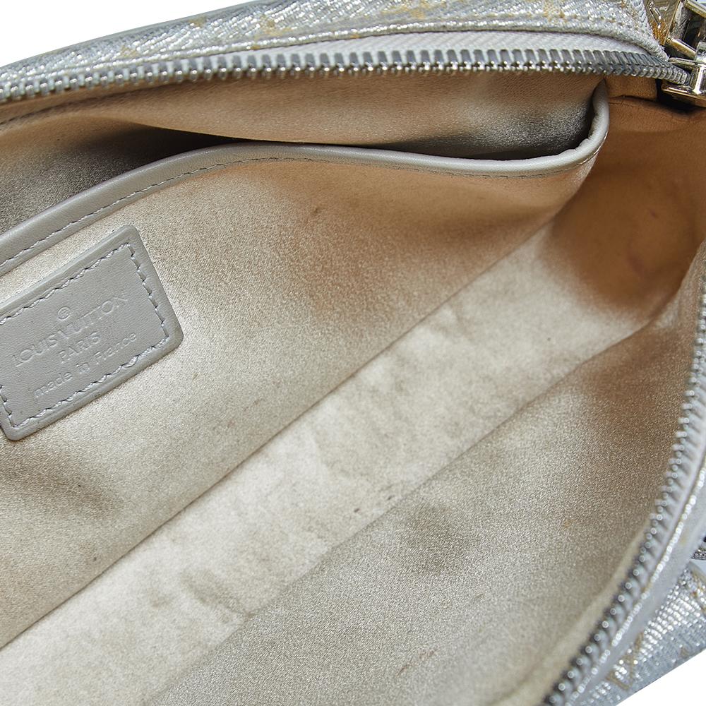 From the House of Louis Vuitton, this Limited Edition Mckenna bag will definitely bring elegance, luxury, and practicality to your ensemble. It is crafted using silver Monogram fabric on the exterior and features a logo detail on the front. It has a