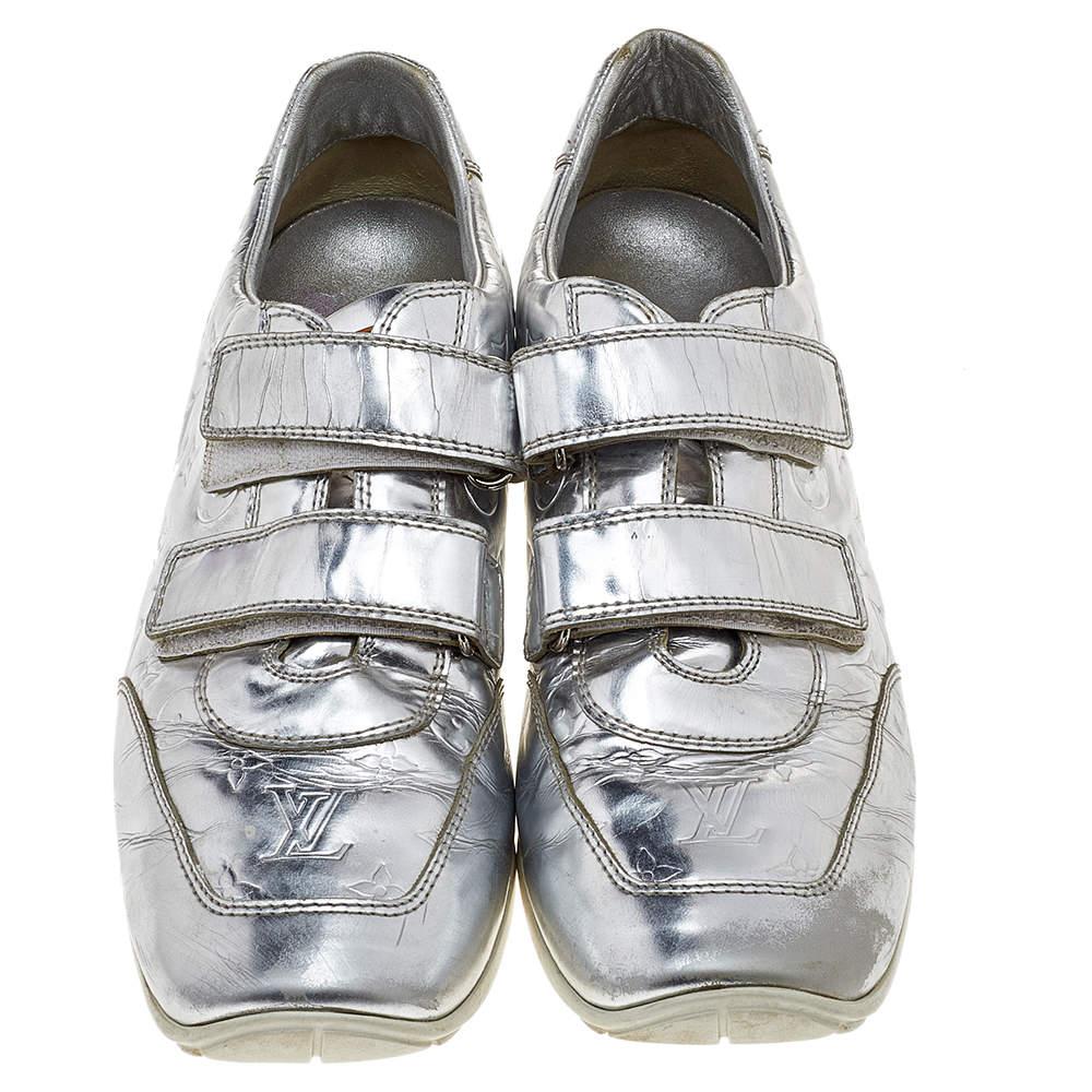 Kick your casual look up a notch with these Mirror tennis shoes by Louis Vuitton. Crafted from metallic leather, they feature the signature Louis Vuitton monogrammed leather details and round toes. They come equipped with velcro fastened fronts. The