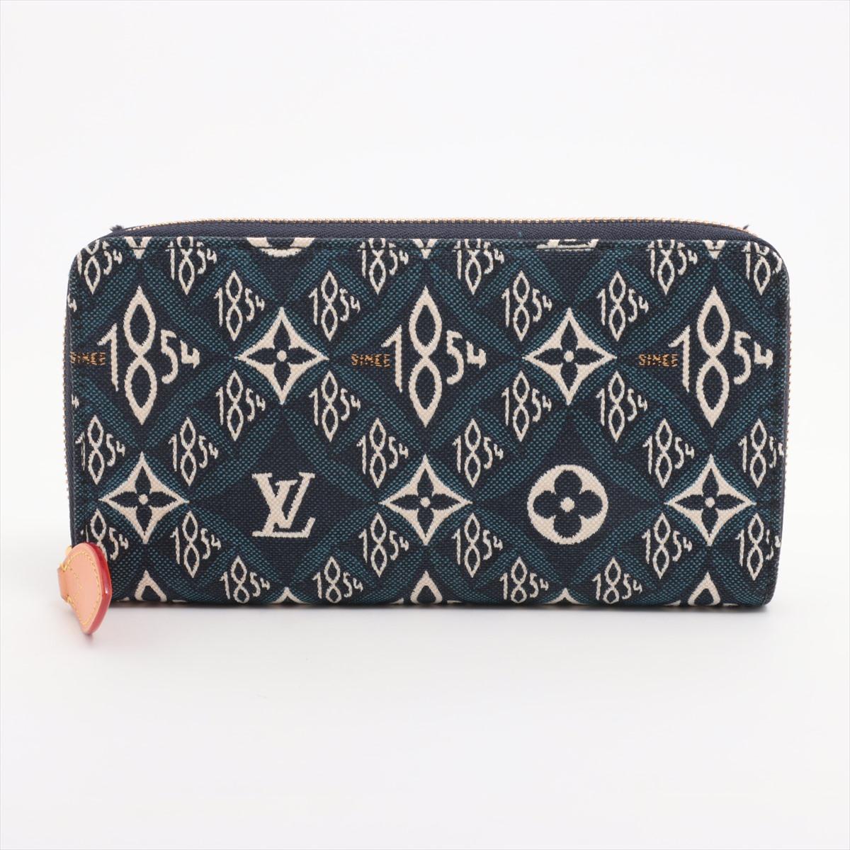 The Louis Vuitton Since 1854 Zippy Long Wallet in Blue combines heritage elegance with modern functionality. Crafted from the Since 1854 jacquard textile, it features an intricate woven pattern that merges Louis Vuitton's monogram motif with the