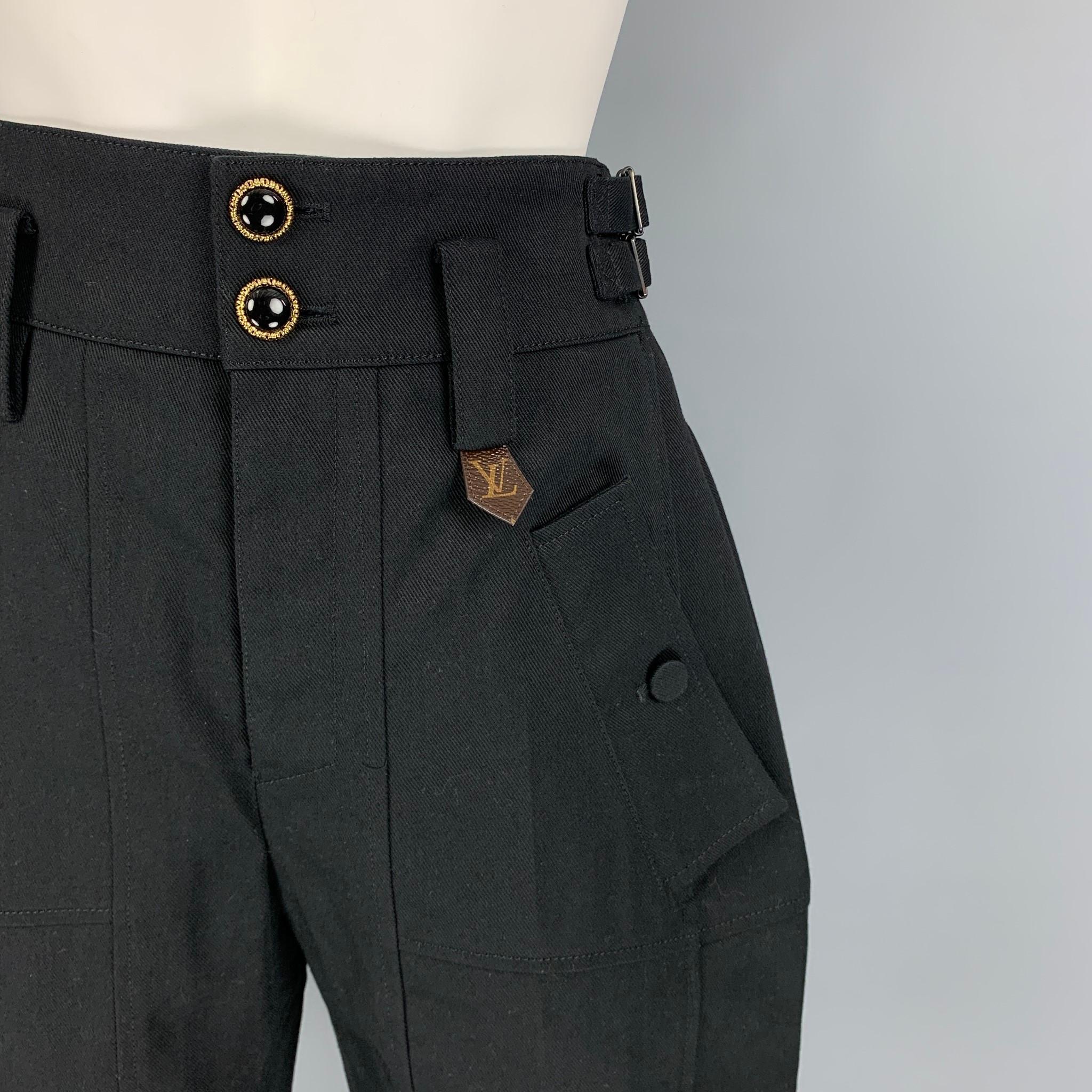 LOUIS VUITTON pants comes in a black cotton / polyester featuring a bermuda style, logo canvas trim, high waisted, adjustable side tabs, front & back, and a button fly closure. Made in Italy. 

New with tags. 
Marked: 34
Original Retail Price: