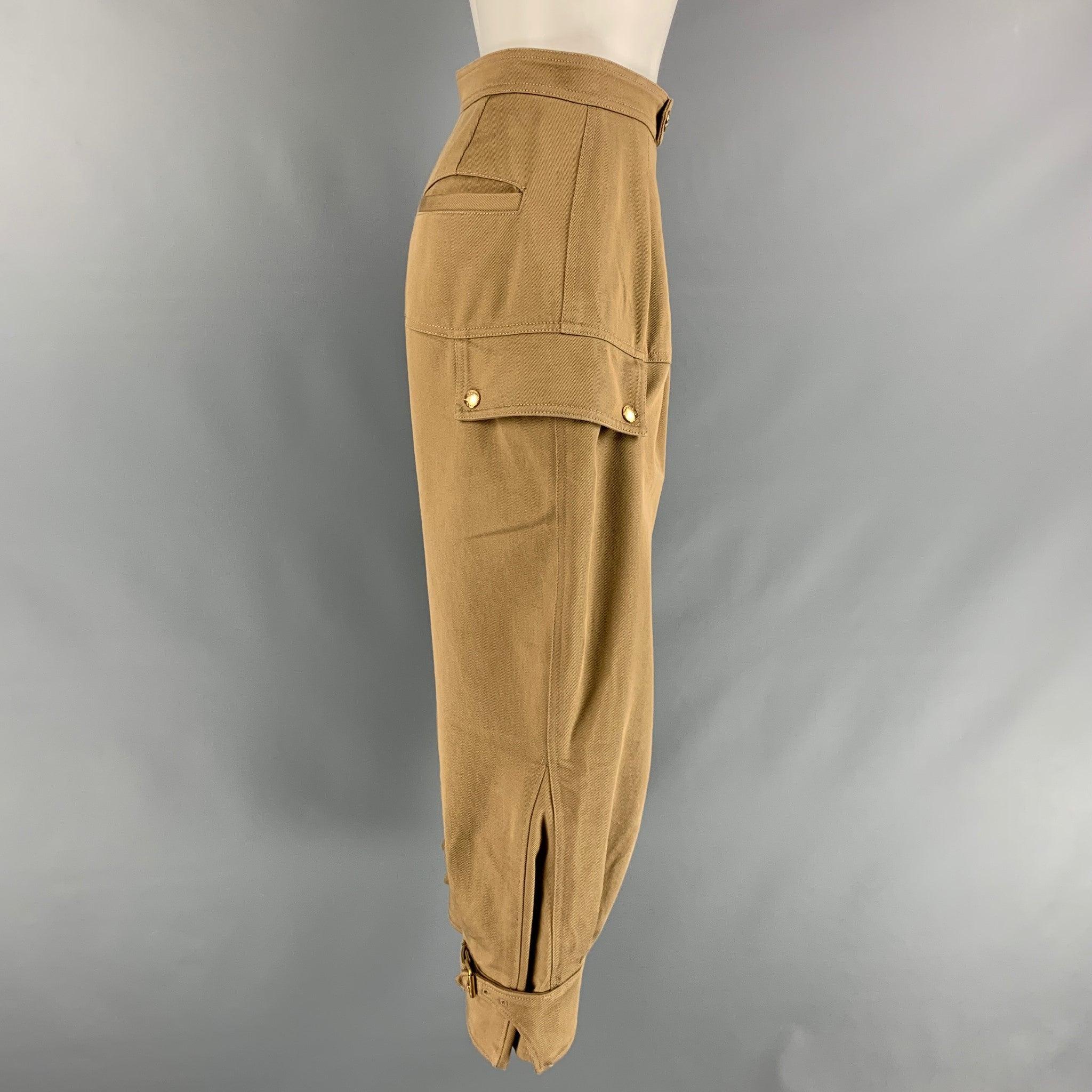 LOUIS VUITTON pants comes in a khaki cotton twill material featuring a cropped design, gold tone trim buttons, side zippers, and LV canvas tab detail. Made in Italy.Excellent Pre-Owned Condition. 

Marked:   34 

Measurements: 
  Waist: 28 inches