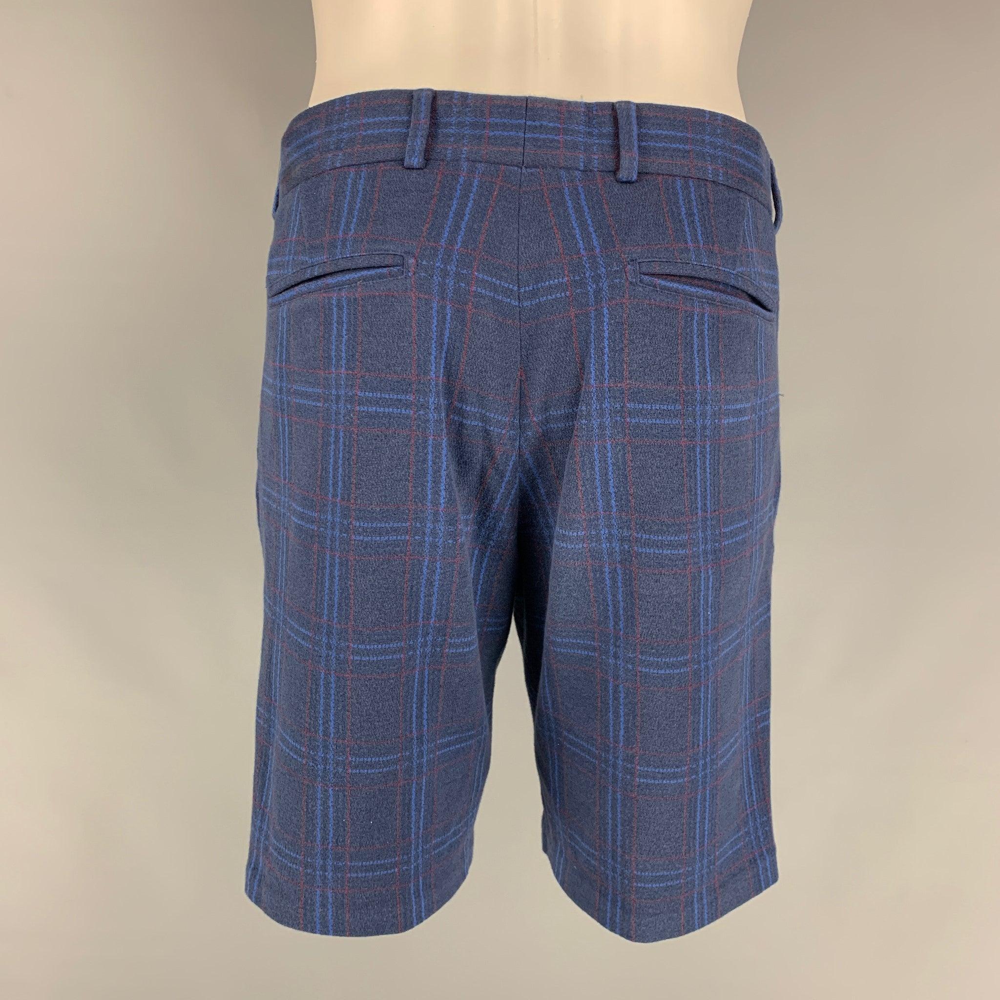 LOUIS VUITTON casual shorts come in navy blue cotton featuring a plaid print, zip up closure and a straight fit. Made in Italy.Very Good Pre-Owned Condition 

Marked:   40 

Measurements: 
  Waist: 32 inches Rise: 10 inches Inseam: 9 inches  
 
 


