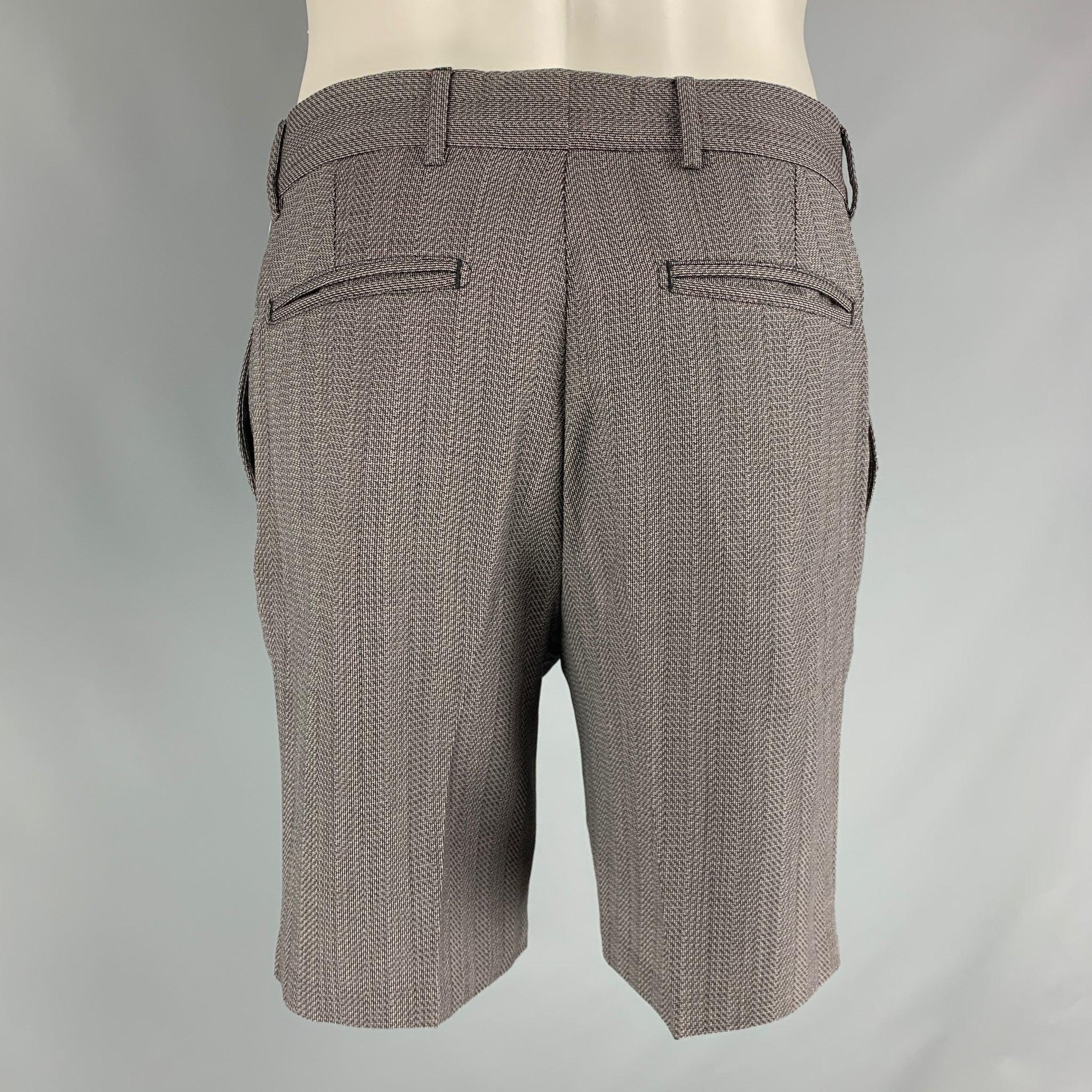 LOUIS VUITTON casual shorts come in grey cotton featuring a nailhead print, zip up closure and a pleated fit. Made in Italy.Very Good Pre-Owned Condition 

Marked:   40 

Measurements: 
  Waist: 32 inches Rise: 10 inches Inseam: 9 inches  
 
 



 
