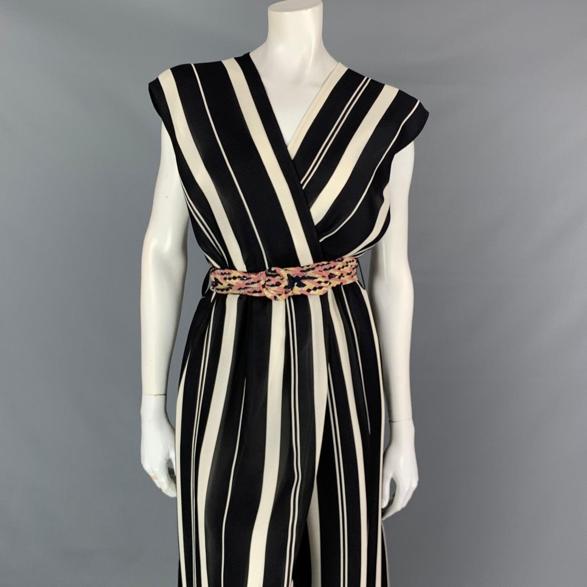 LOUIS VUITTON sleeveless wrap dress with a plunging neckline and tulip skirt, in striped gazar and silk georgette. A dash of geometric transparency and a runway-inspired fabric belt with round buckle make this an effortlessly elegant look for day or