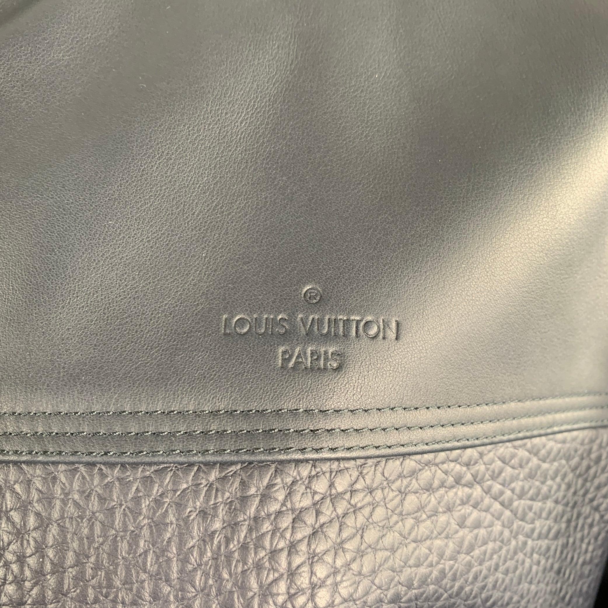 LOUIS VUITTON jacket
in a navy bull leather featuring mixed textures (smooth and pebble grain), a blouson bomber style, and zip up closure. Made in Italy.Excellent Pre-Owned Condition. 

Marked:   IT 50 

Measurements: 
 
Shoulder: 18 inches Chest: