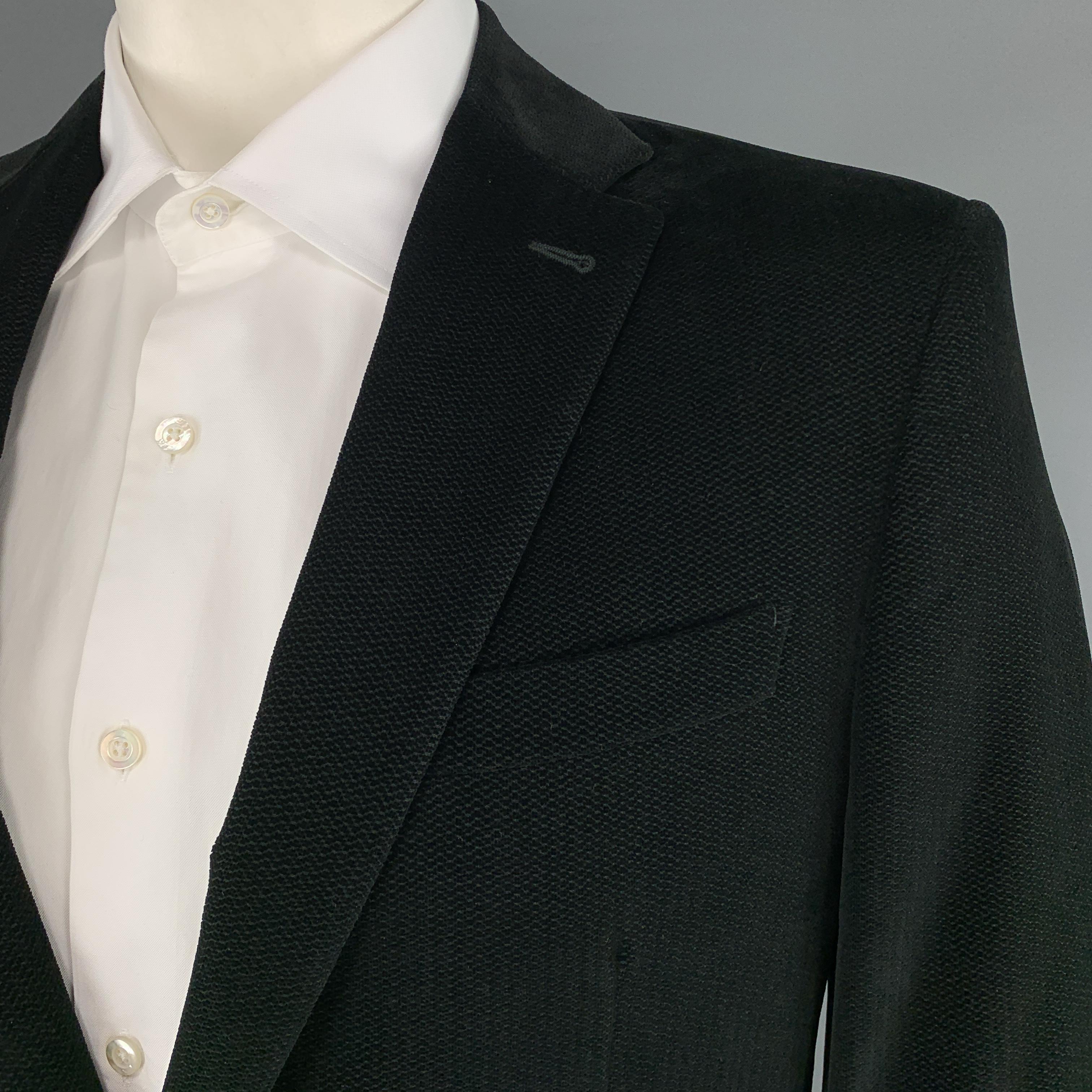 LOUIS VUITTON single breasted sport coat comes in a textured velvet with a two button front, notch lapel, flap pockets, and functional button cuffs. With garment bag. Made in Italy.
 

Excellent Pre-Owned Condition.
Marked: IT