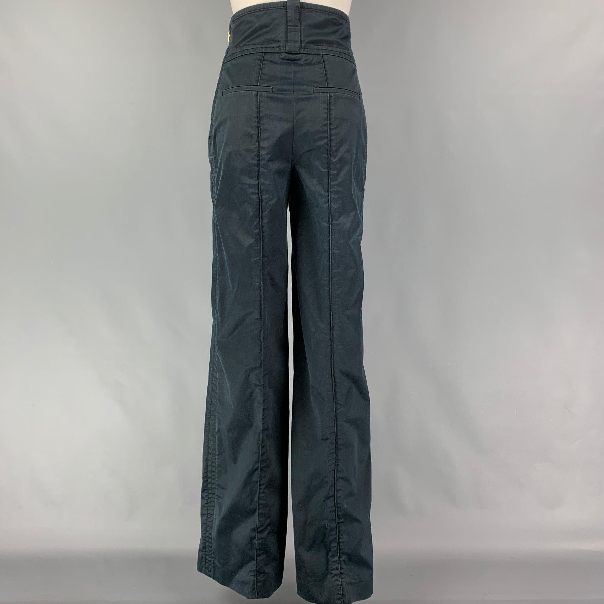 LOUIS VUITTON dress pants comes in a navy cotton featuring a high waist, wide leg, slit pockets, and a sie zipper closure. Made in Italy.
Very Good
Pre-Owned Condition. 

Marked:   38 

Measurements: 
  Waist: 28 inches  Rise: 14 inches  Inseam: 36