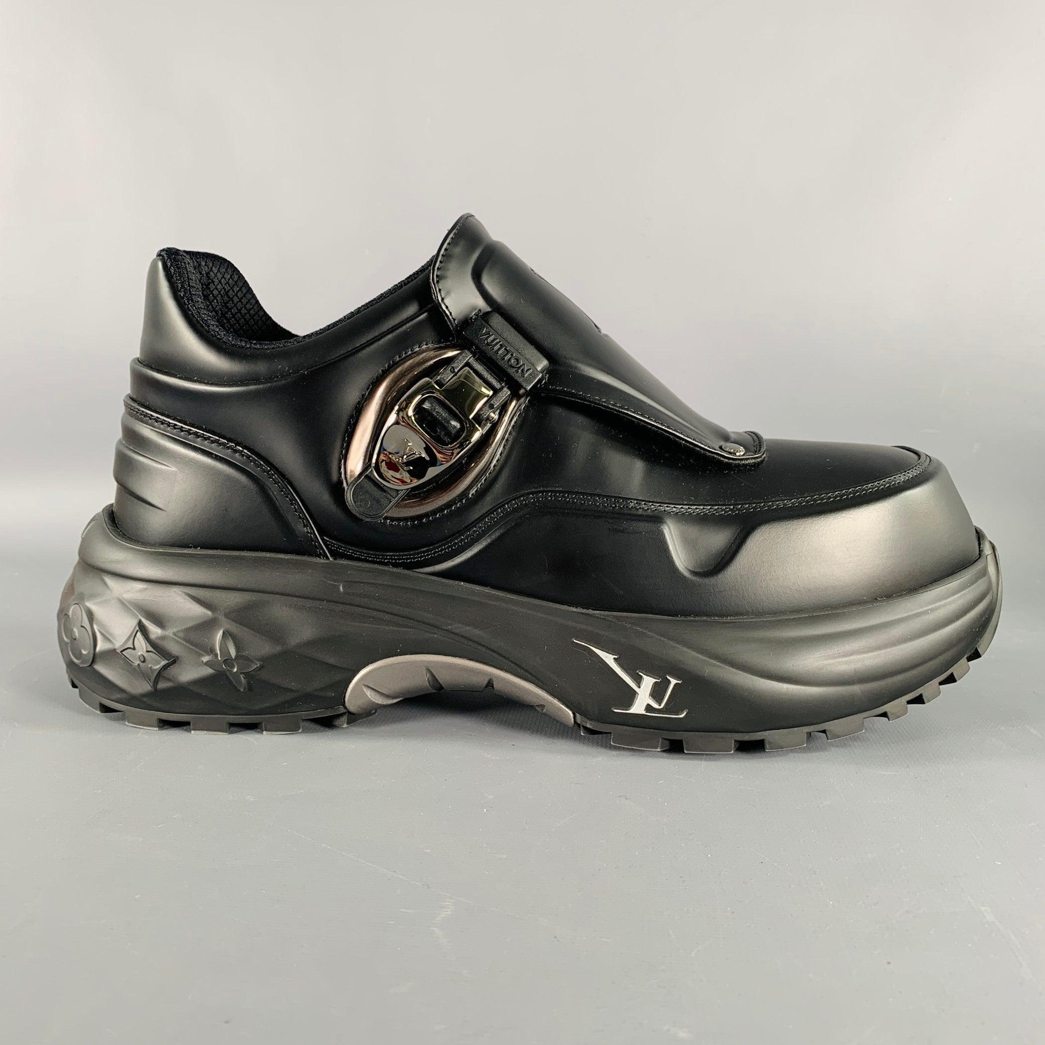 LOUIS VUITTON sneakers
in a black fabric featuring an embossed LV logo tongue design, chunky rubber sole, and silver tone metal side buckle closure. Comes with dust bags. Made in Italy.New without Box. 

Marked:   HD 0253 8Outsole: 12 inches  x 4.75