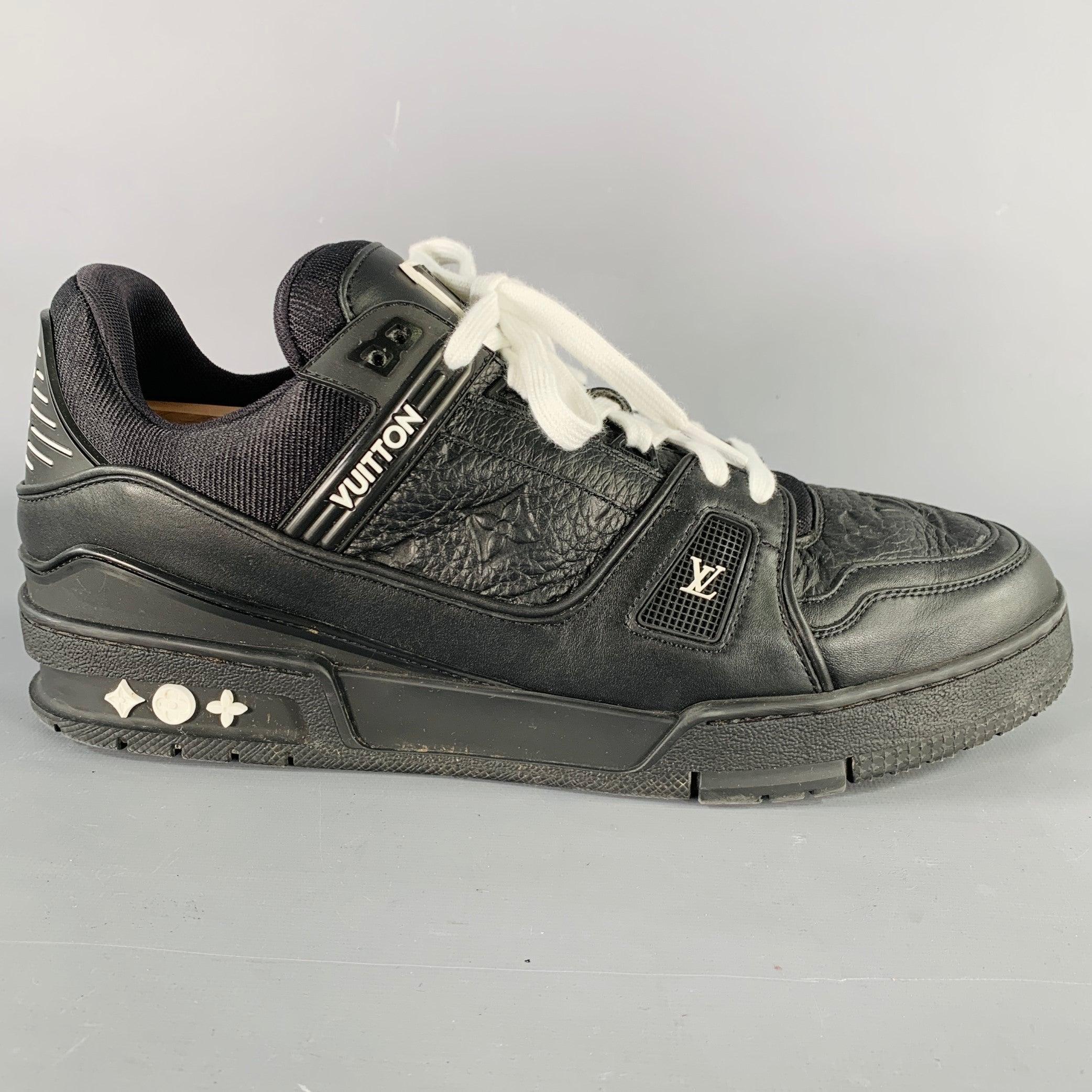 LOUIS VUITTON sneakers
in a black leather featuring white monogram and brand details, chunky rubber sole, and lace-up closure. Shoe trees not included. Note: these sneakers were consigned without original LV-branded laces. Made in Italy.Very Good
