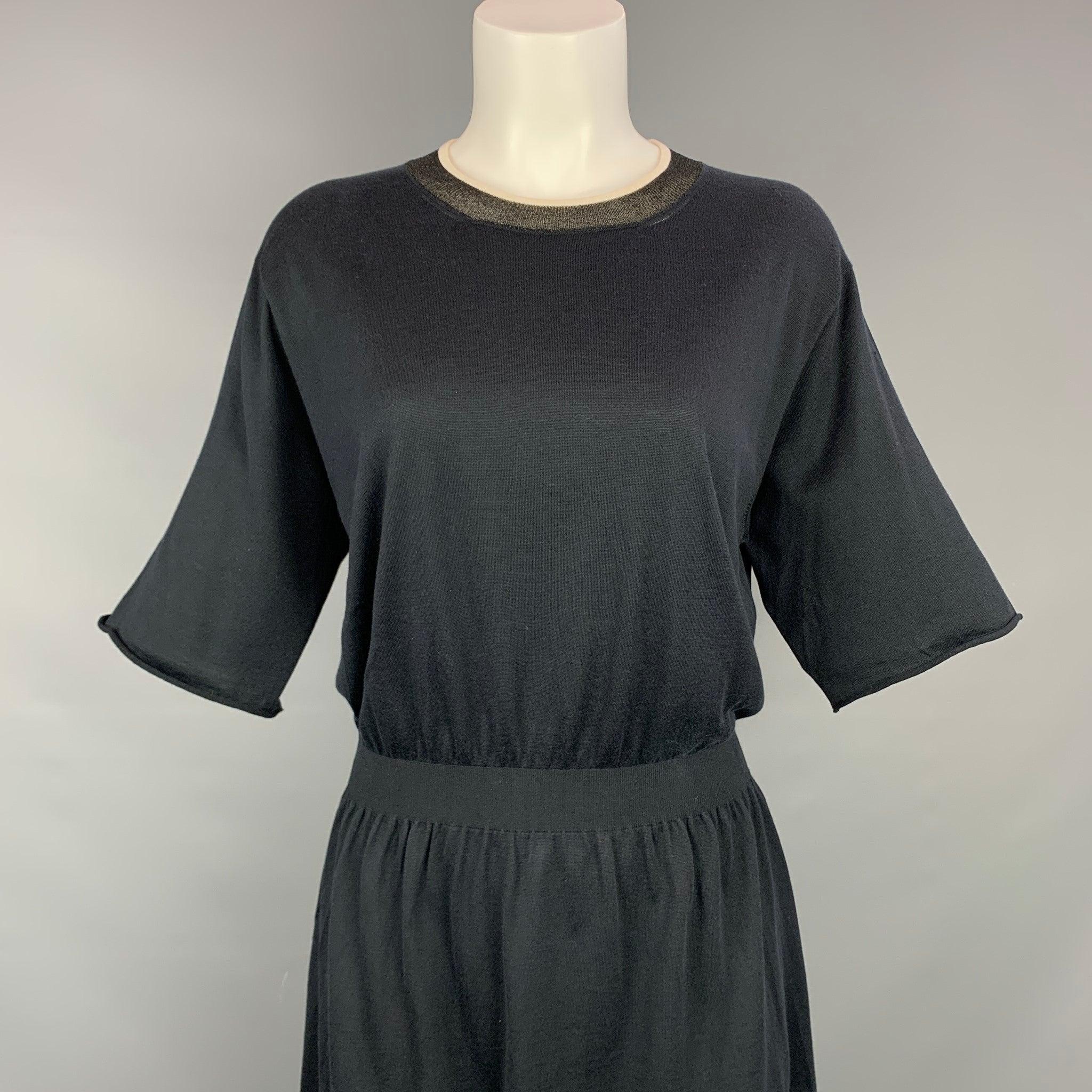LOUIS VUITTON dress comes in a black knitted silk / cotton featuring a elastic waist, ribbed hem, short sleeves, and a crew-neck. Made in Italy.New With Tags.  

Marked:   L 

Measurements: 
 
Shoulder: 17 inches  Bust: 36 inches  Waist: 28 inches 