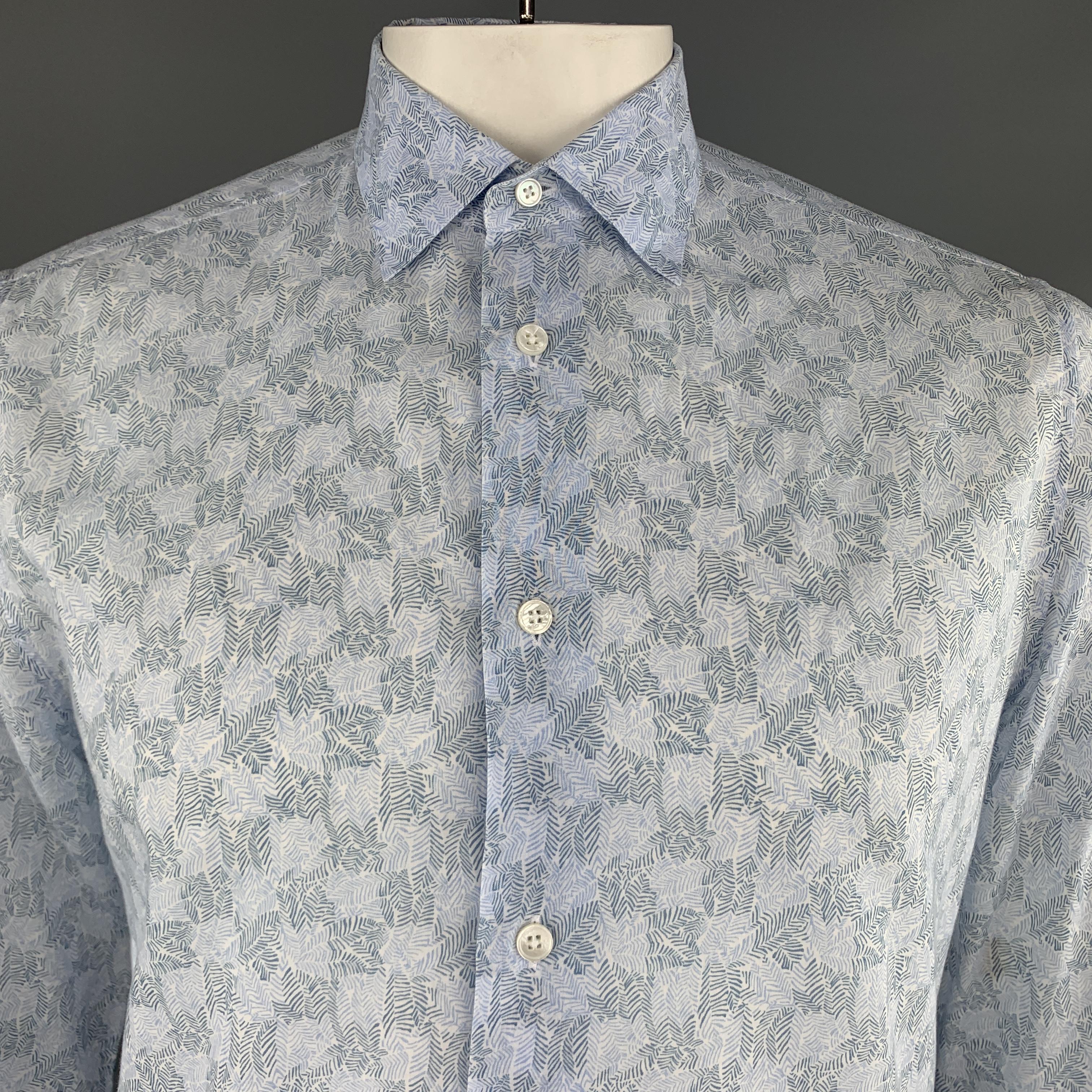 LOUIS VUITTON shirt comes in light blue leaf print cotton with a pointed collar and rolled tab button sleeve. Made in Italy.

Excellent Pre-Owned Condition.
Marked:  L

Measurements:

Shoulder: 16 in.
Chest: 44 in.
Sleeve: 27 in.
Length: 29 in.