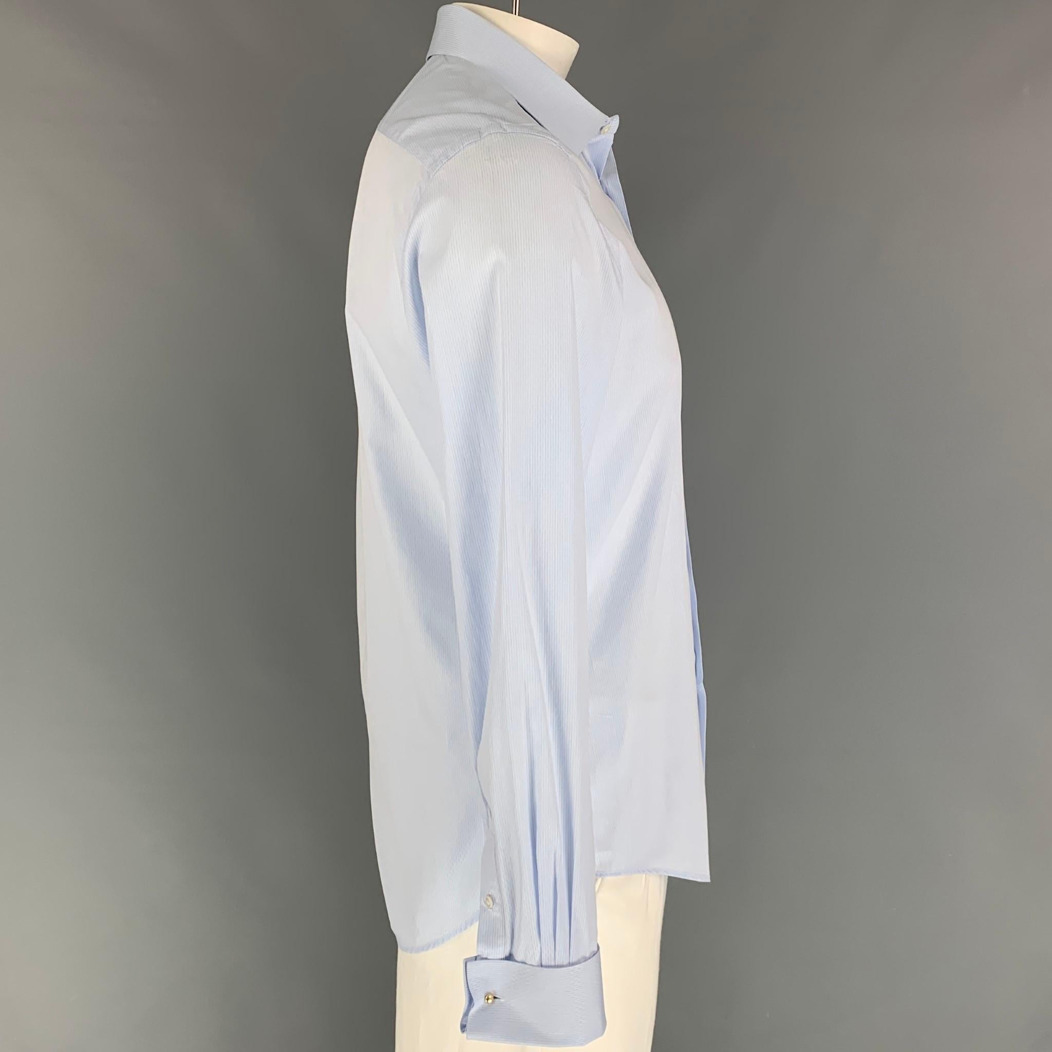 LOUIS VUITTON long sleeve shirt comes in a light blue print cotton featuring a slim fit, french cuffs, spread collar, and a button up closure. Made in Italy. 

Excellent Pre-Owned Condition.
Marked: 42/17

Measurements:

Shoulder: 18 in.
Chest: 42