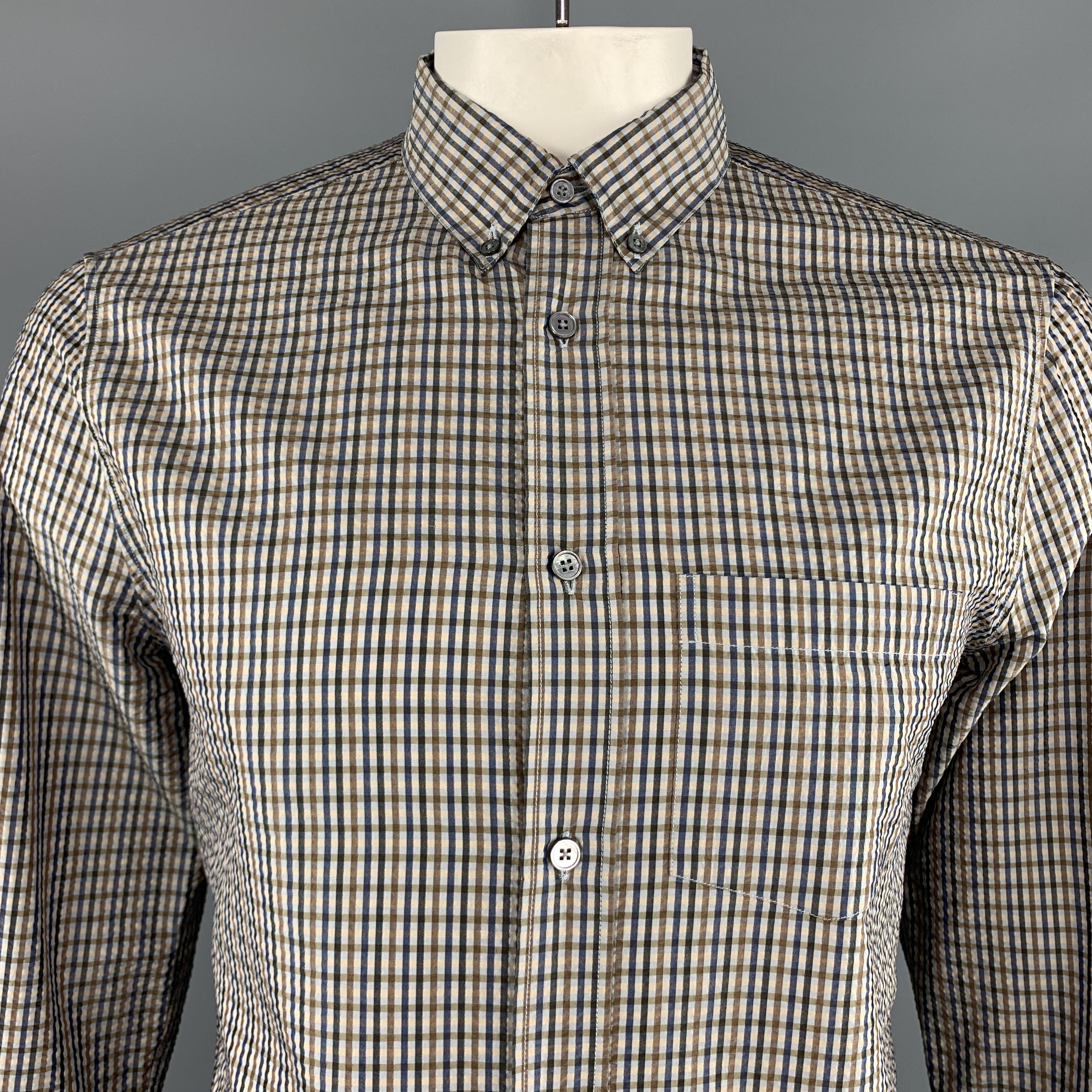 LOUIS VUITTON shirt comes in taupe and navy plaid print textured silk with a button down pointed collar and patch breast pocket. Made in Italy.

Excellent Pre-Owned Condition.
Marked: L

Measurements:

Shoulder: 16.5 in.
Chest: 44 in.
Sleeve: 28