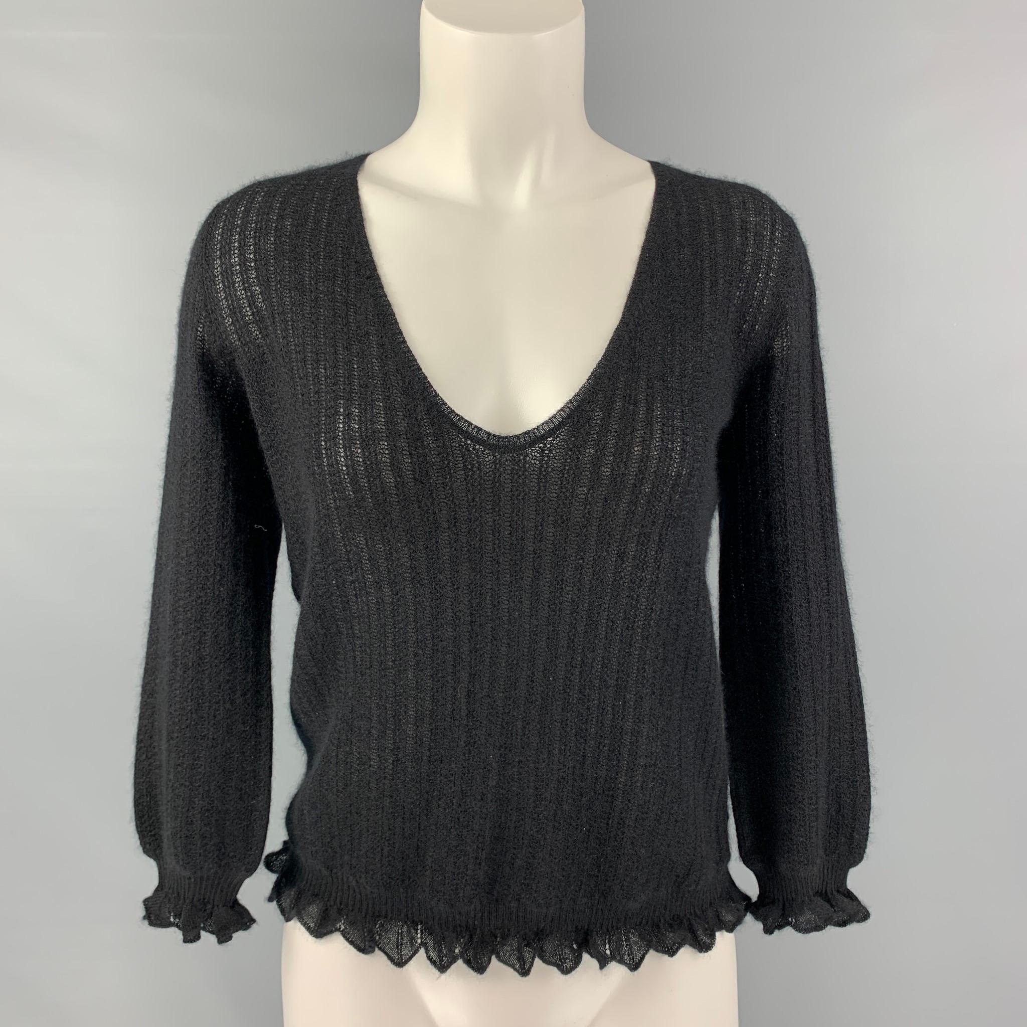 LOUIS VUITTON 3/4 sleeves sweater comes in a black cashmere knit fabric featuring v-neck, and ruffled detail at sleeves and bottom hem. Made in Italy.

Good Pre-Owned Condition. Minor Sign of Wear.
Marked: M

Measurements:

Shoulder: 14 in
Bust: 38