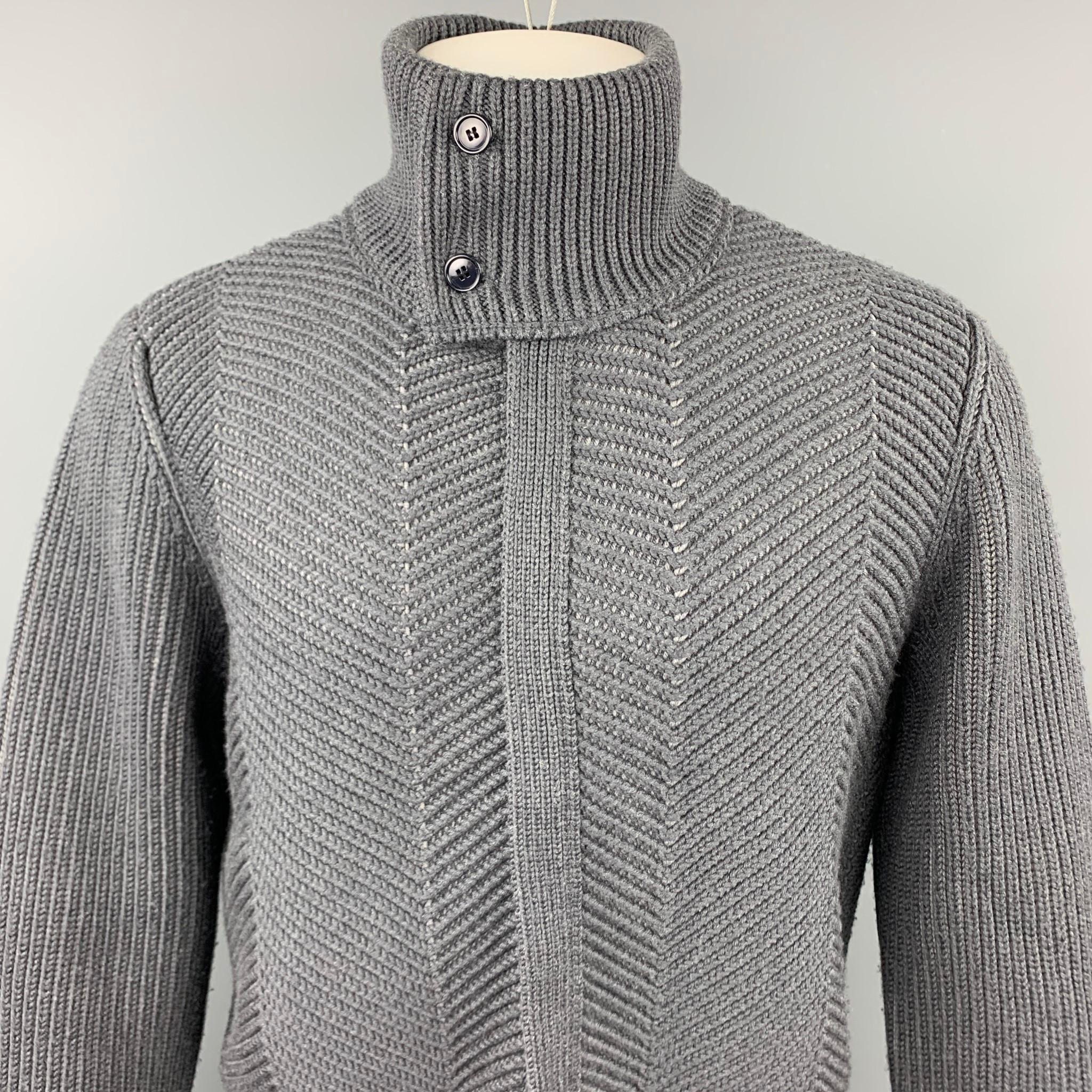 LOUIS VUITTON jacket comes in a gray knitted wool blend featuring a buttoned high collar and a hidden zip up closure. Made in Italy.

Excellent Pre-Owned Condition.
Marked: M
Original Retail Price: $2,500.00

Measurements:

Shoulder: 18 in. 
Chest: