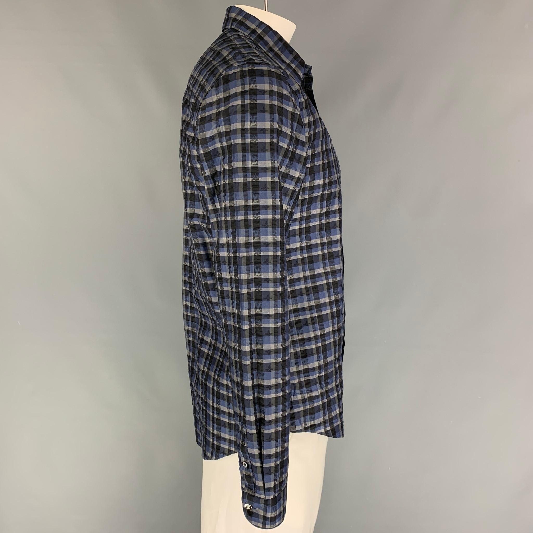 LOUIS VUITTON long sleeve shirt comes in a blue & black plaid silk featuring a spread collar and a button up closure. Made in Italy. 

Excellent Pre-Owned Condition.
Marked: XL / 9

Measurements:

Shoulder: 18 in.
Chest: 42 in.
Sleeve: 27.5