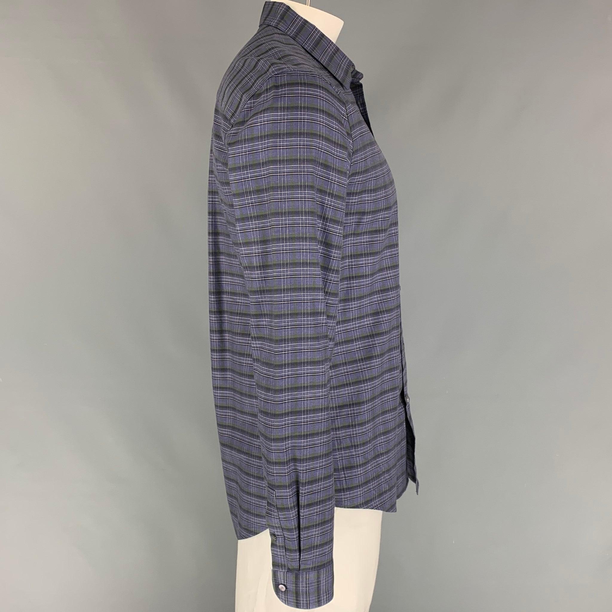 LOUIS VUITTON long sleeve shirt comes in a purple & black plaid cotton featuring a spread collar and a button up closure. Made in Italy.
Excellent
Pre-Owned Condition. 

Marked:   XL  

Measurements: 
 
Shoulder: 19 inches  Chest: 42 inches  Sleeve: