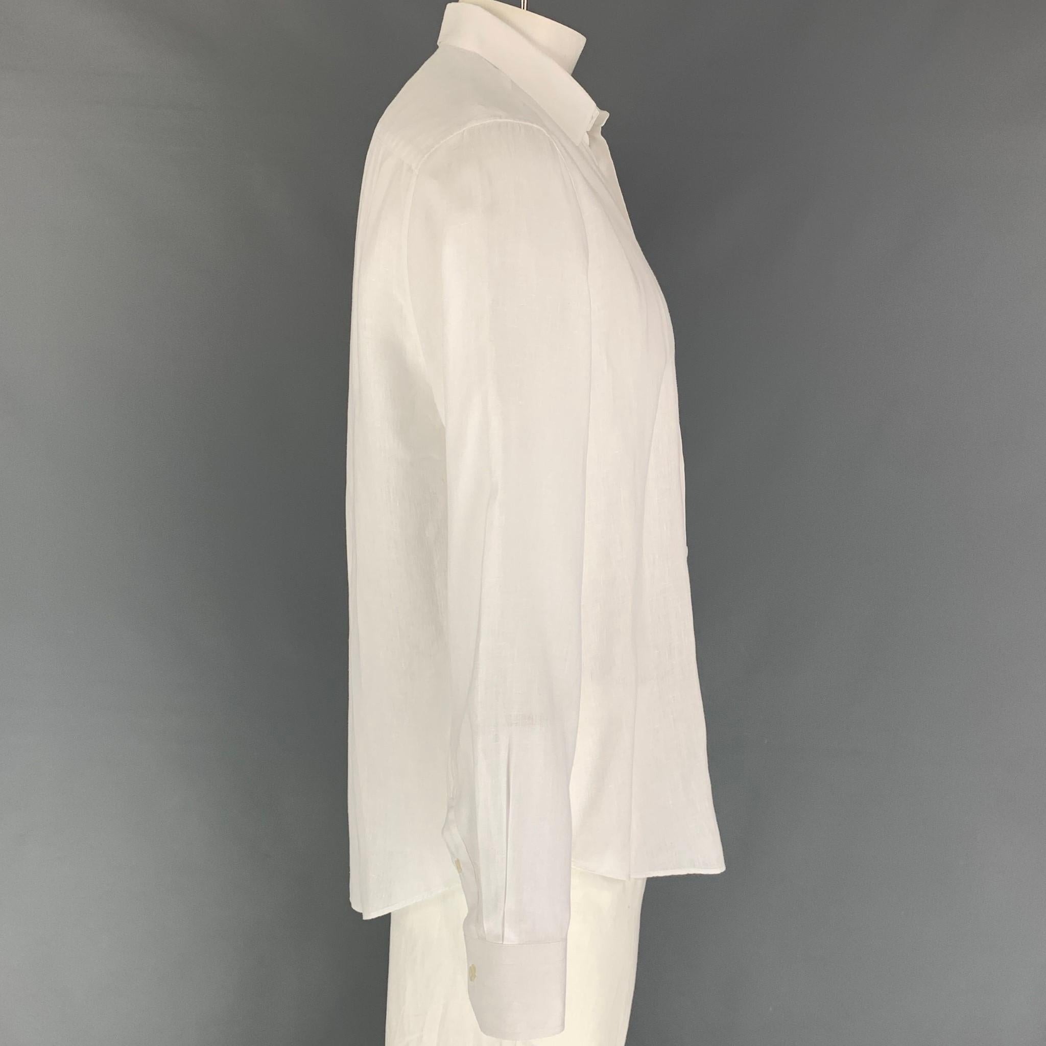 LOUIS VUITTON long sleeve shirt comes in a white linen featuring a front pocket, embroidered logo, spread collar, and a button up closure. Made in Italy. 

Excellent Pre-Owned Condition.
Marked: XL

Measurements:

Shoulder: 18 in.
Chest: 46